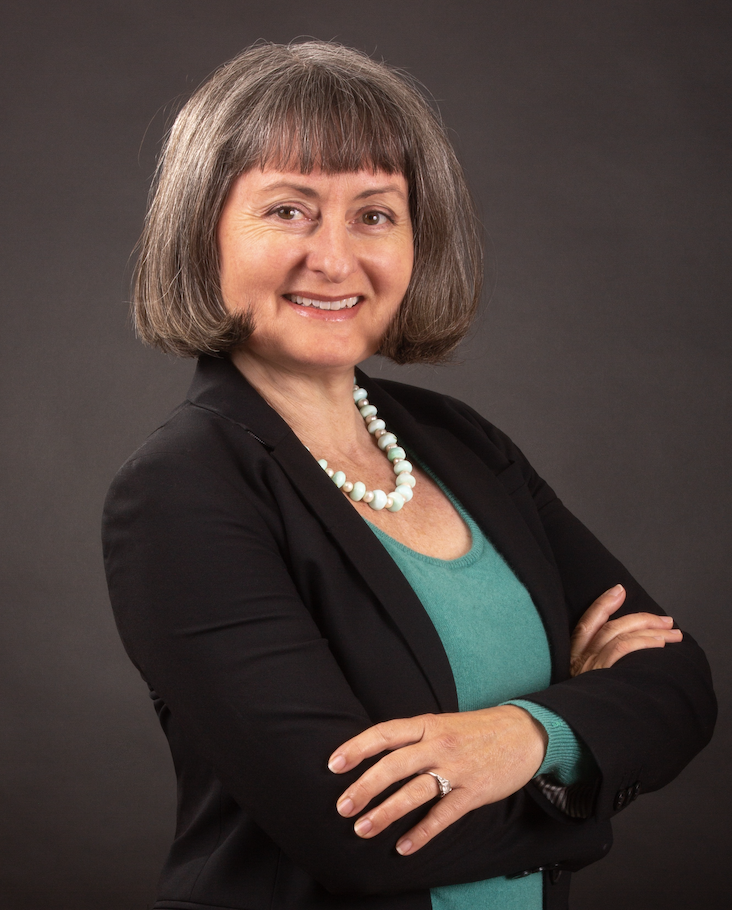 Endorsement of Meghan Sahli-Wells for Eunisses Hernandez. She is featured wearing a black blazer and a turquoise shirt smiling in front of a gray background.