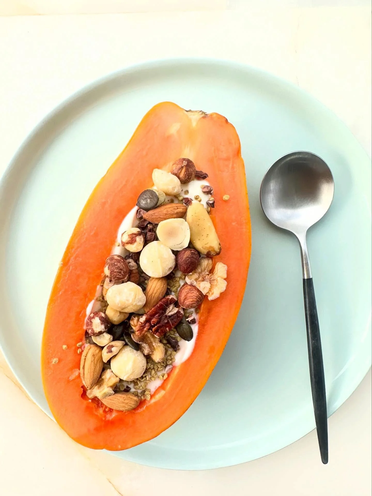 Papaya breakfast bowl &hellip;. Scoop out the seeds but be sure to eat a couple mouthfuls as the seeds are anti parasitic. 

Full cavity with full fat yogurt, bee pollen, mixed activated nuts, cacao nibs and other yummies of your fancy.