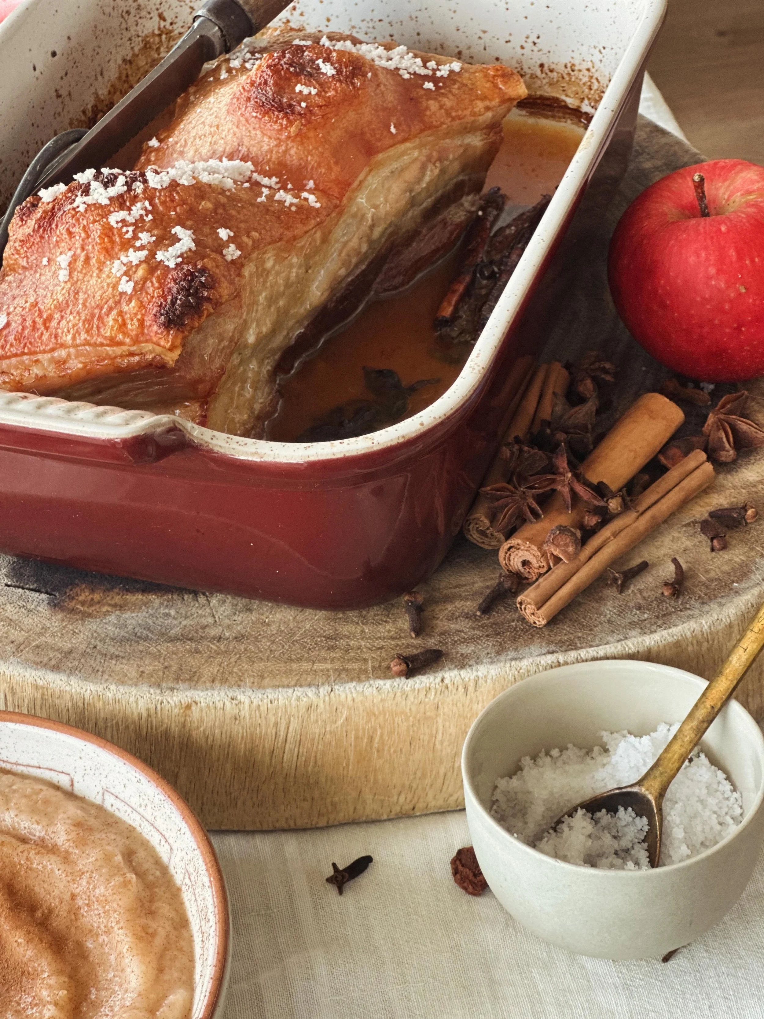 Succulent roast pork with crispy crackling that was marinating overnight in apple cider vinegar and aromatics like cinnamon quills, cloves and star anise (the key to making fresh pork more digestible!!) 

Teamed with apple sauce infused with butter, 
