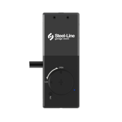 A remote control for Steel-Line garage doors with a circular control dial, an 'Open' label, and a small indicator light.