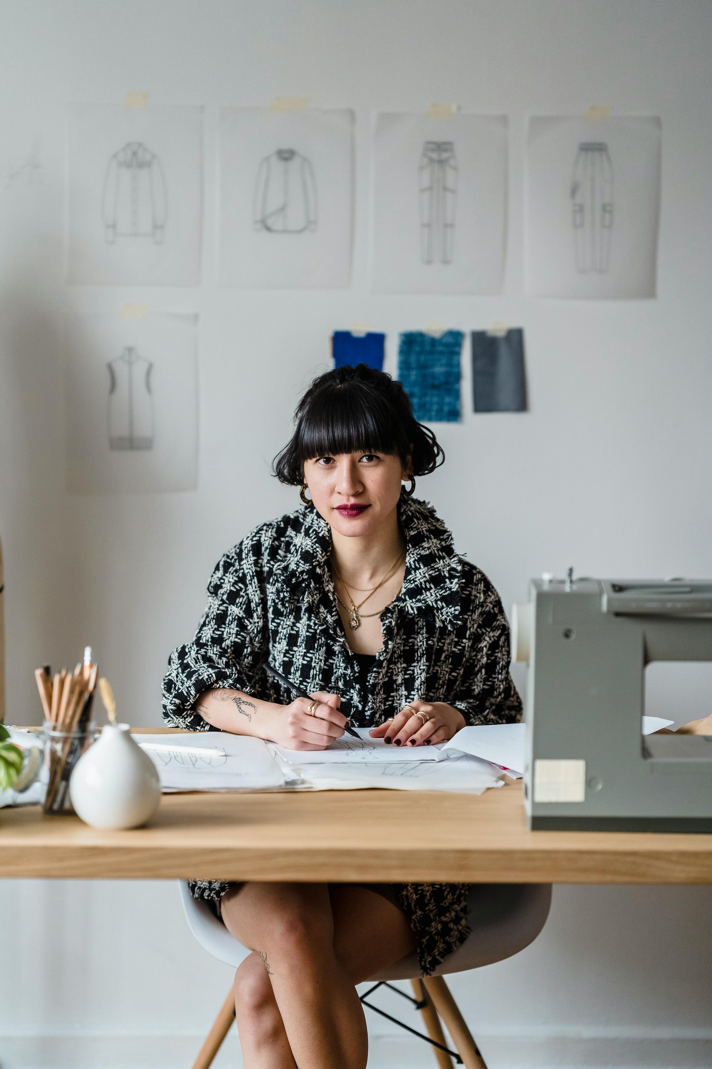 A woman sitting at a desk, shaping a bespoke format for The Pivot to suit specific business needs and agendas.