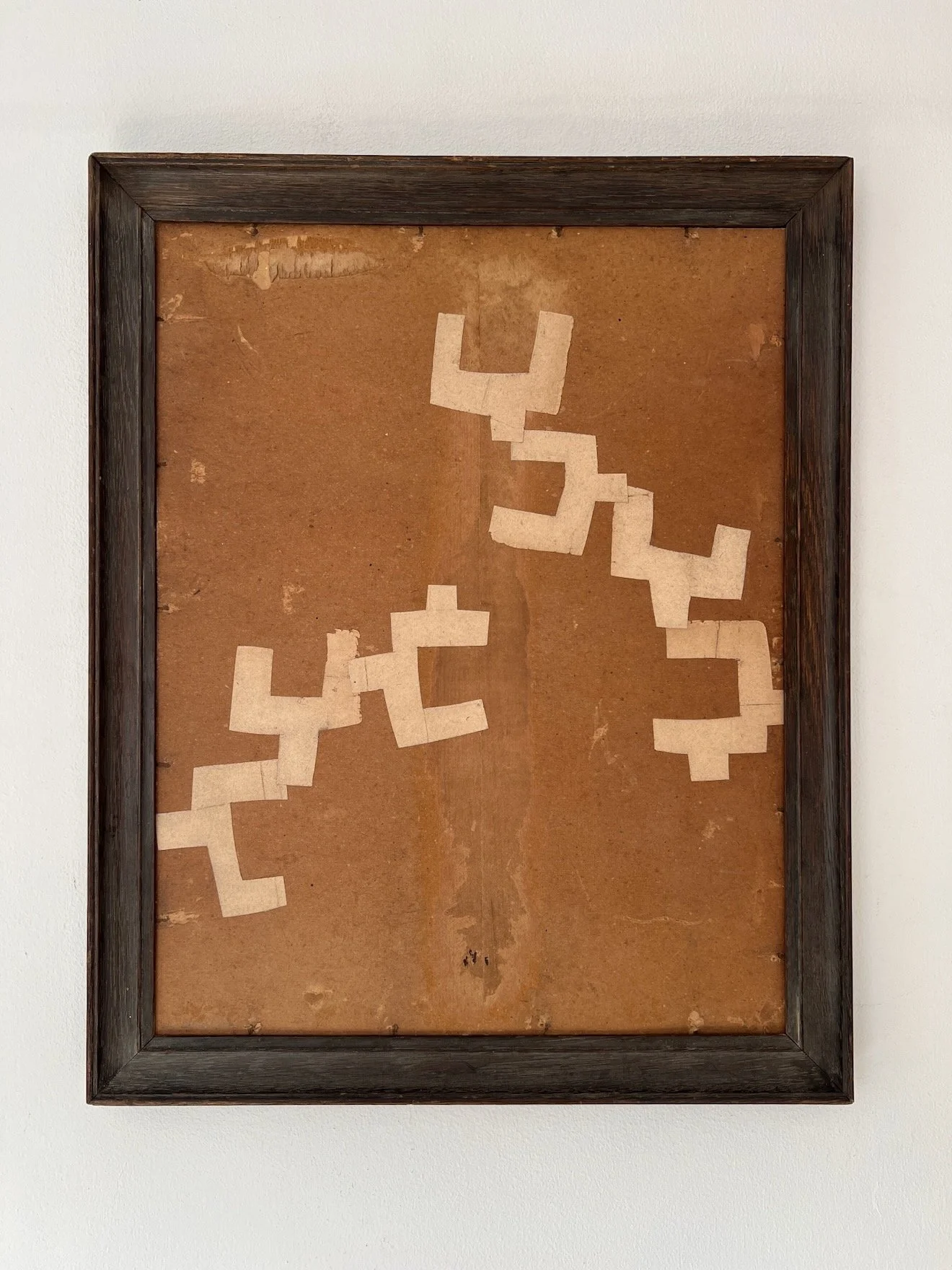 Seven by Lucy Naughton is a contemporary collage artwork using found materials in a vintage frame. Muted earth tones and textures mean it will fit beautifully in any interior.