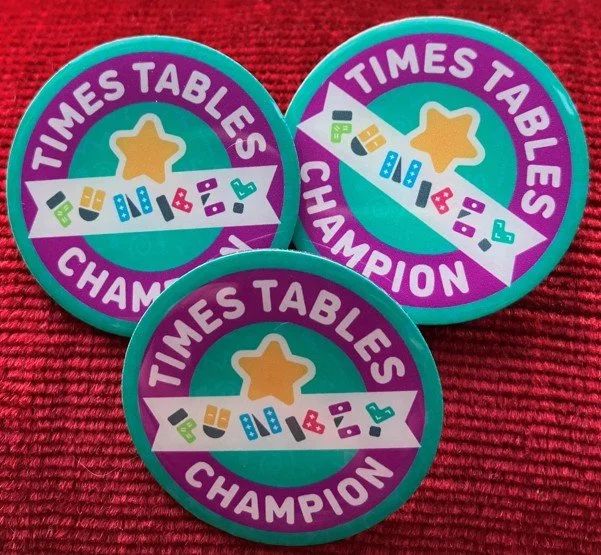 Three badges cropped.jpg