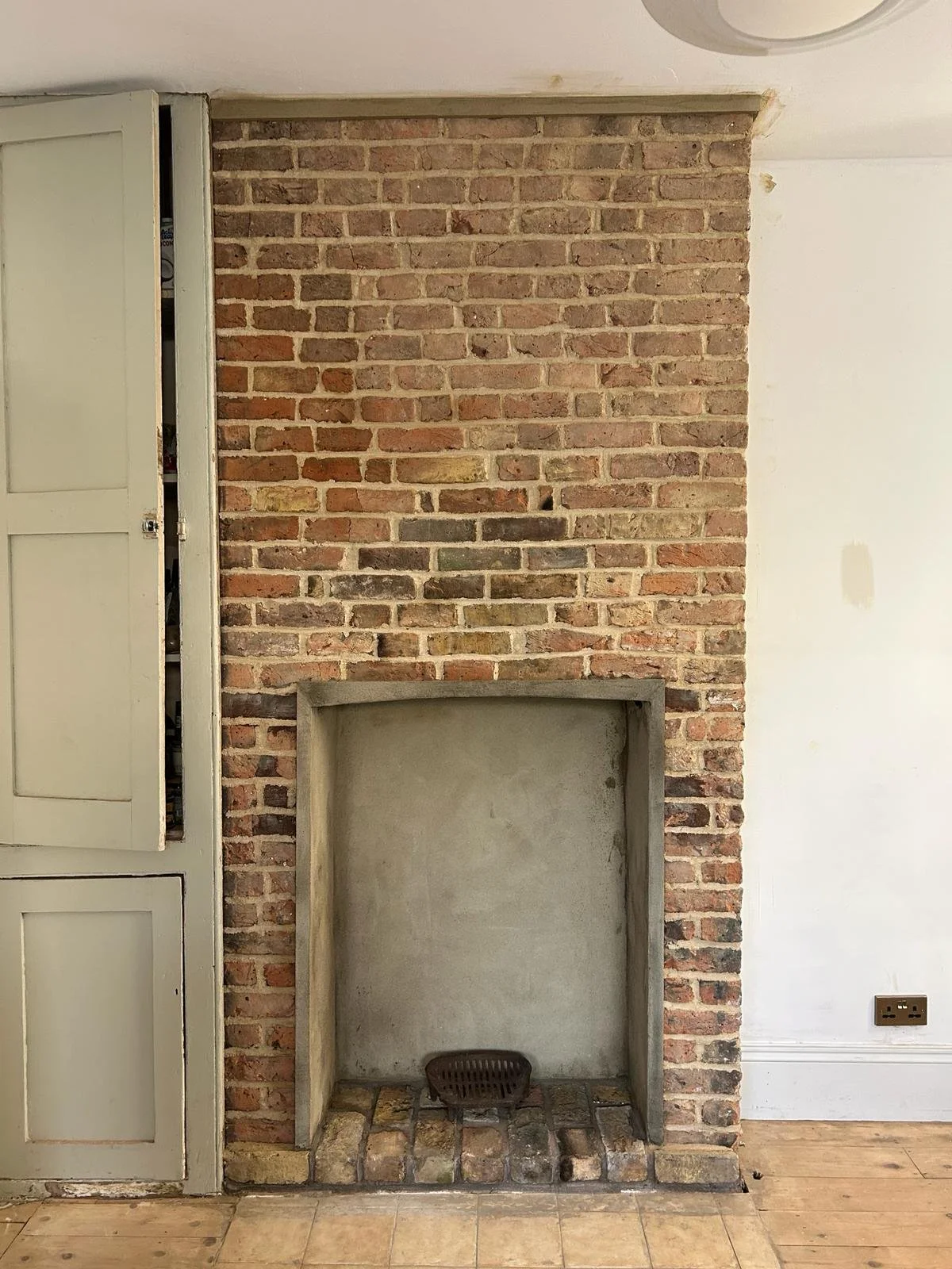 Exposing brick wall Chimney Breast in Leytonstone, London, England