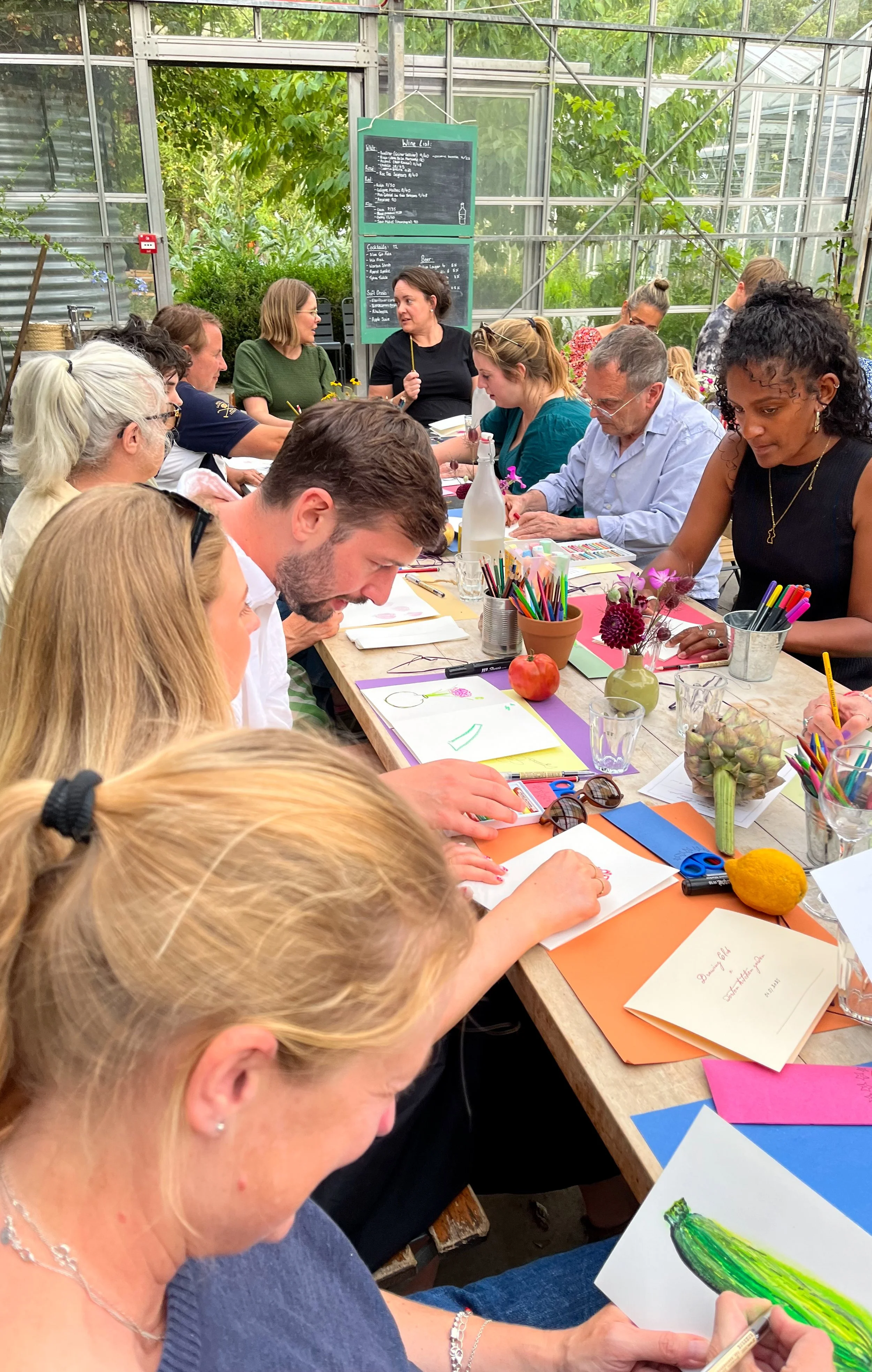 Group of people concentrating on their drawings.