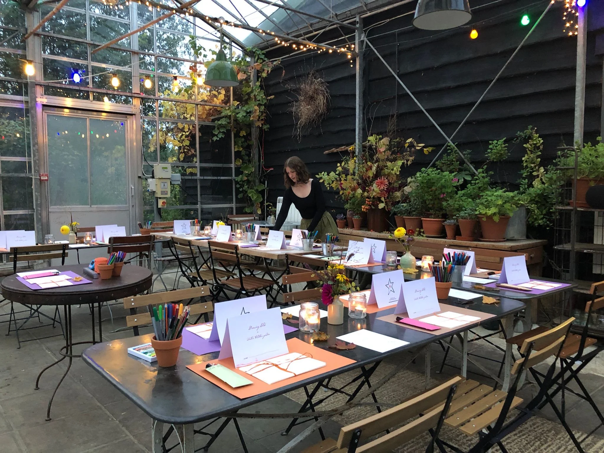Drawing Club host Bethan, setting up for a workshop.