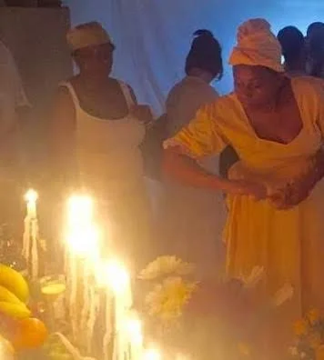 A Priestess giving offerings at an altar