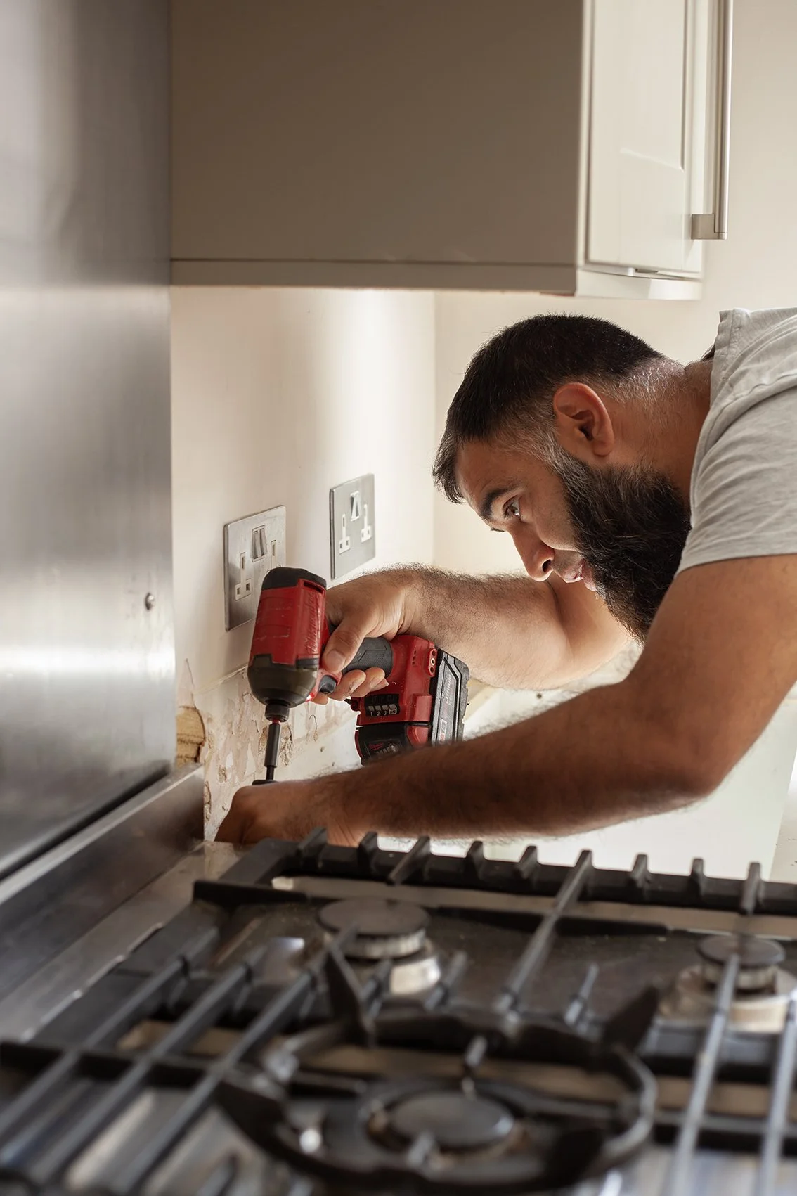 Sajid Khan, a handyman. Working at a domestic property in St Albans.
UK, 2025