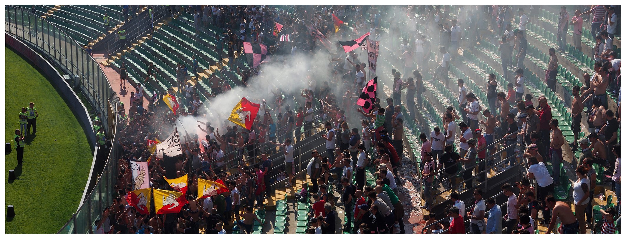 Ultras at the Palermo - Atalanta football match. After the match the Ultras chant and release flares. 2018.