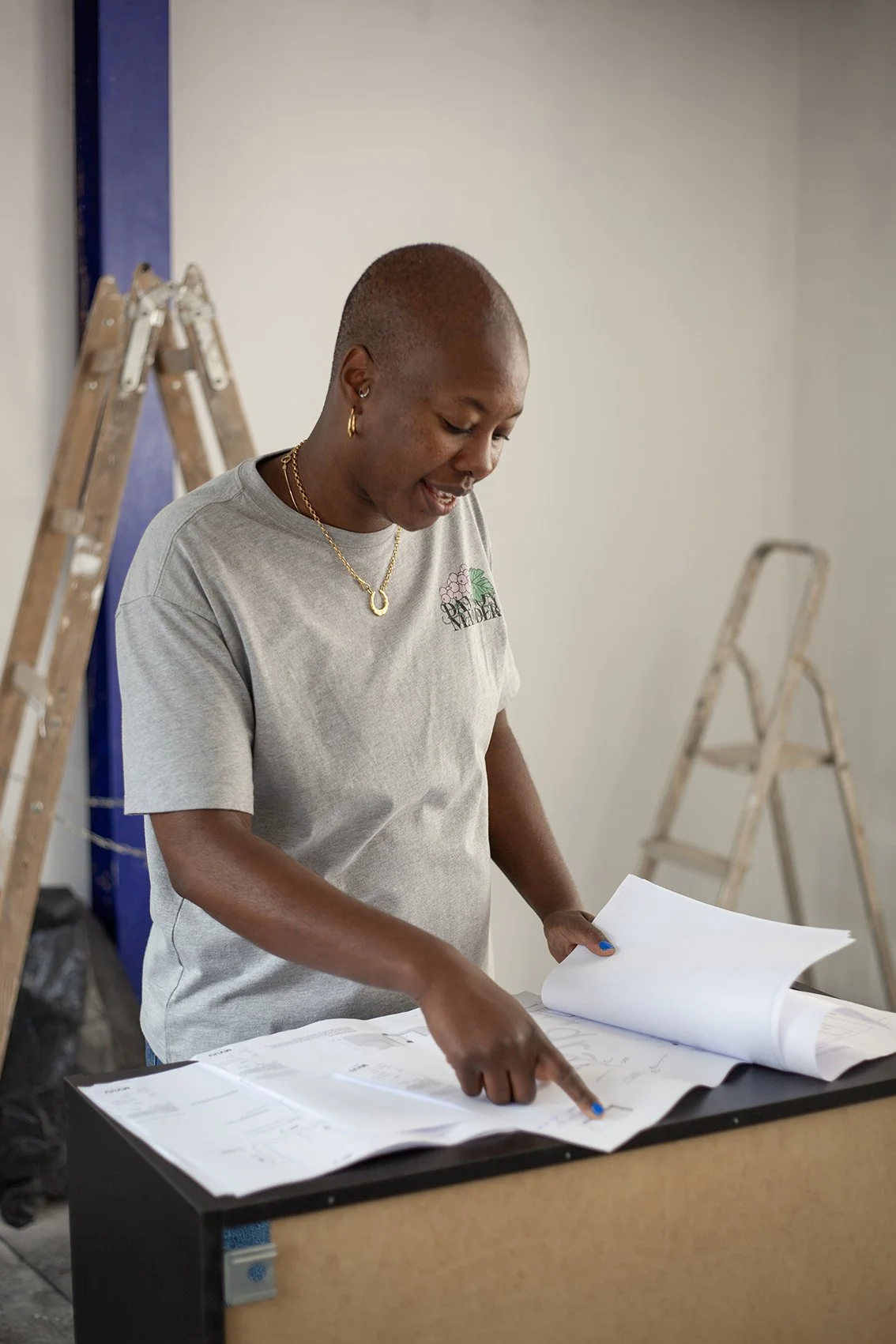 Checkatrade work. Styled shoot. Customer at their actual property which is undergoing refurbishment. Looking at plans. London.