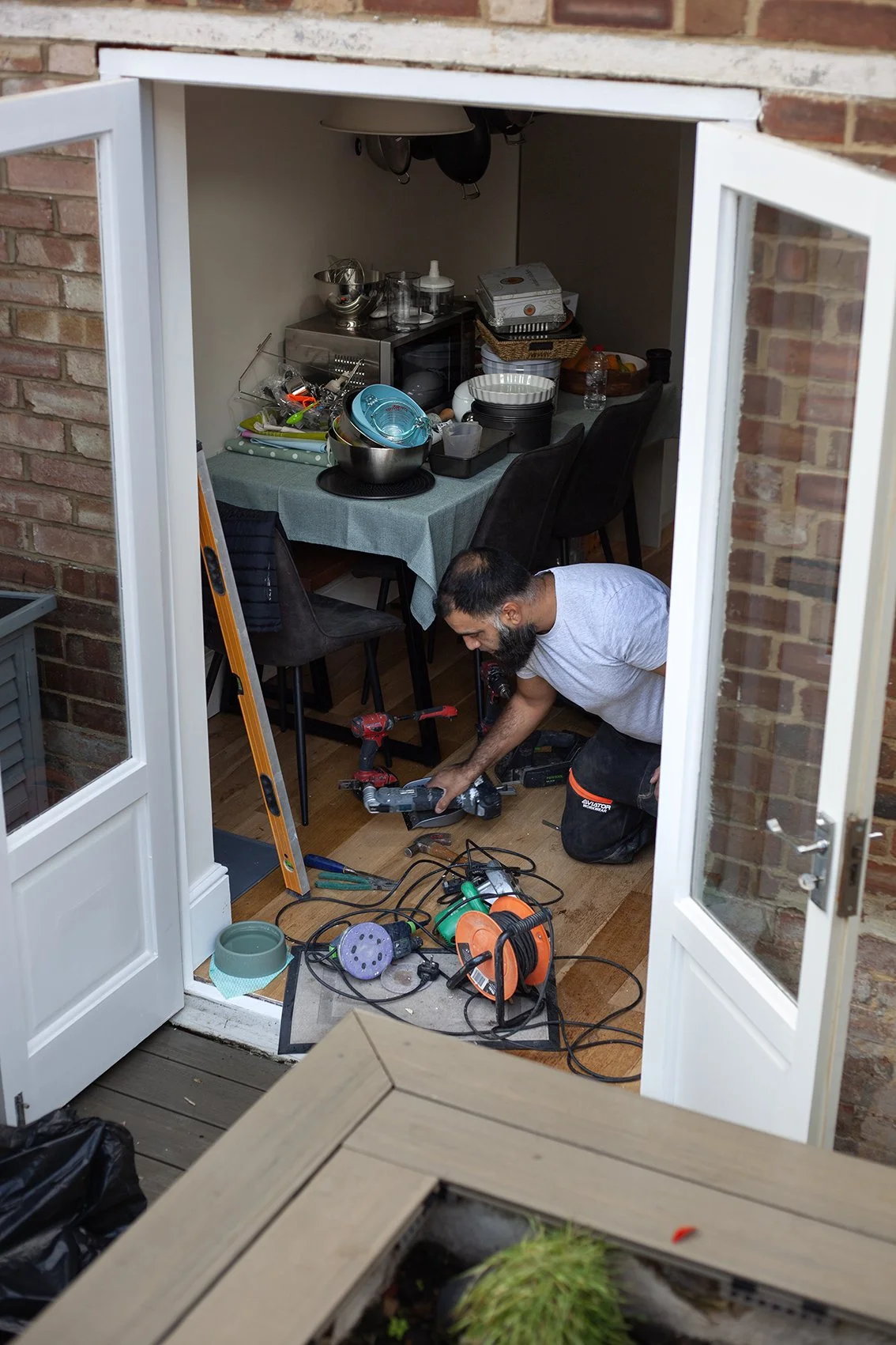 Sajid Khan, a handyman. Working at a domestic property in St Albans.
UK, 2025