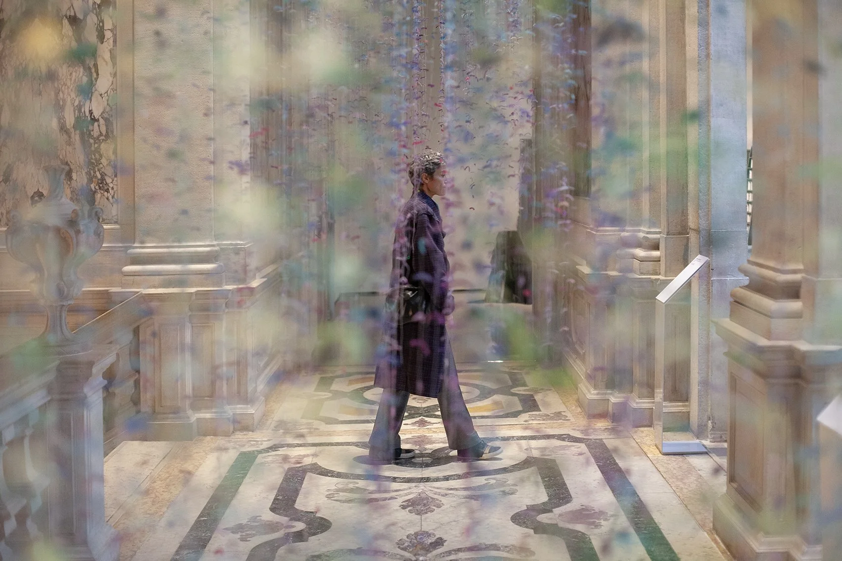 Documenting the Venice Biennale. Visitor to exhibition at the Doge Palace. Italy.