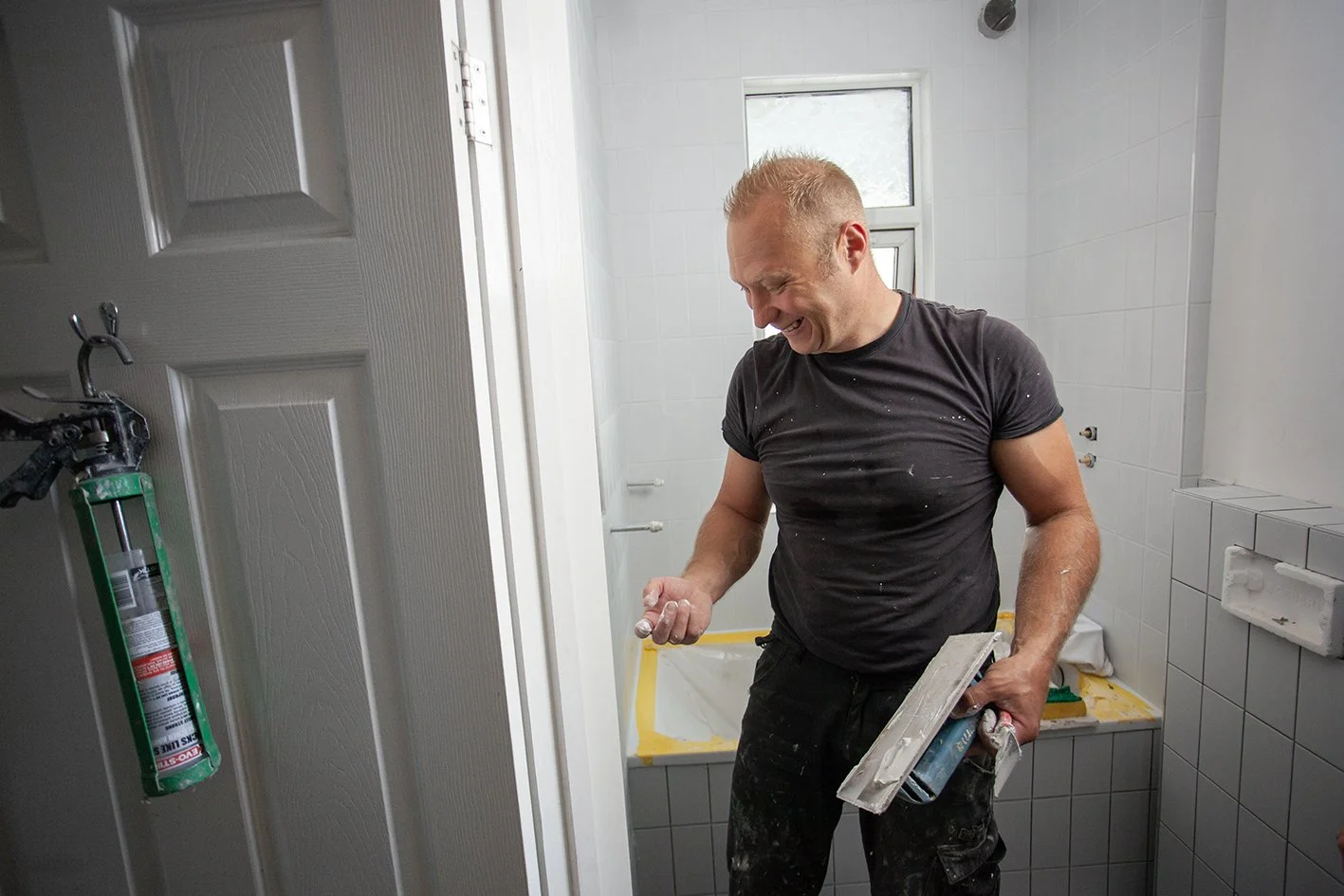 Checkatrade work. Harringay, London. Tomazs, at work as a bathroom renovator. 2025.