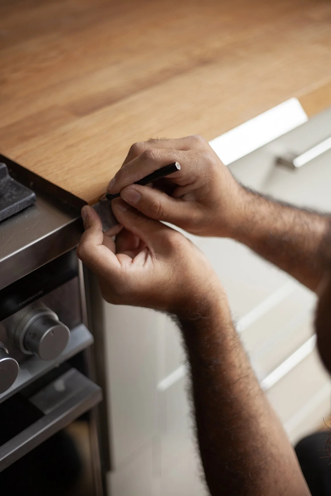 Sajid Khan, a handyman. Working at a domestic property in St Albans.
UK, 2025