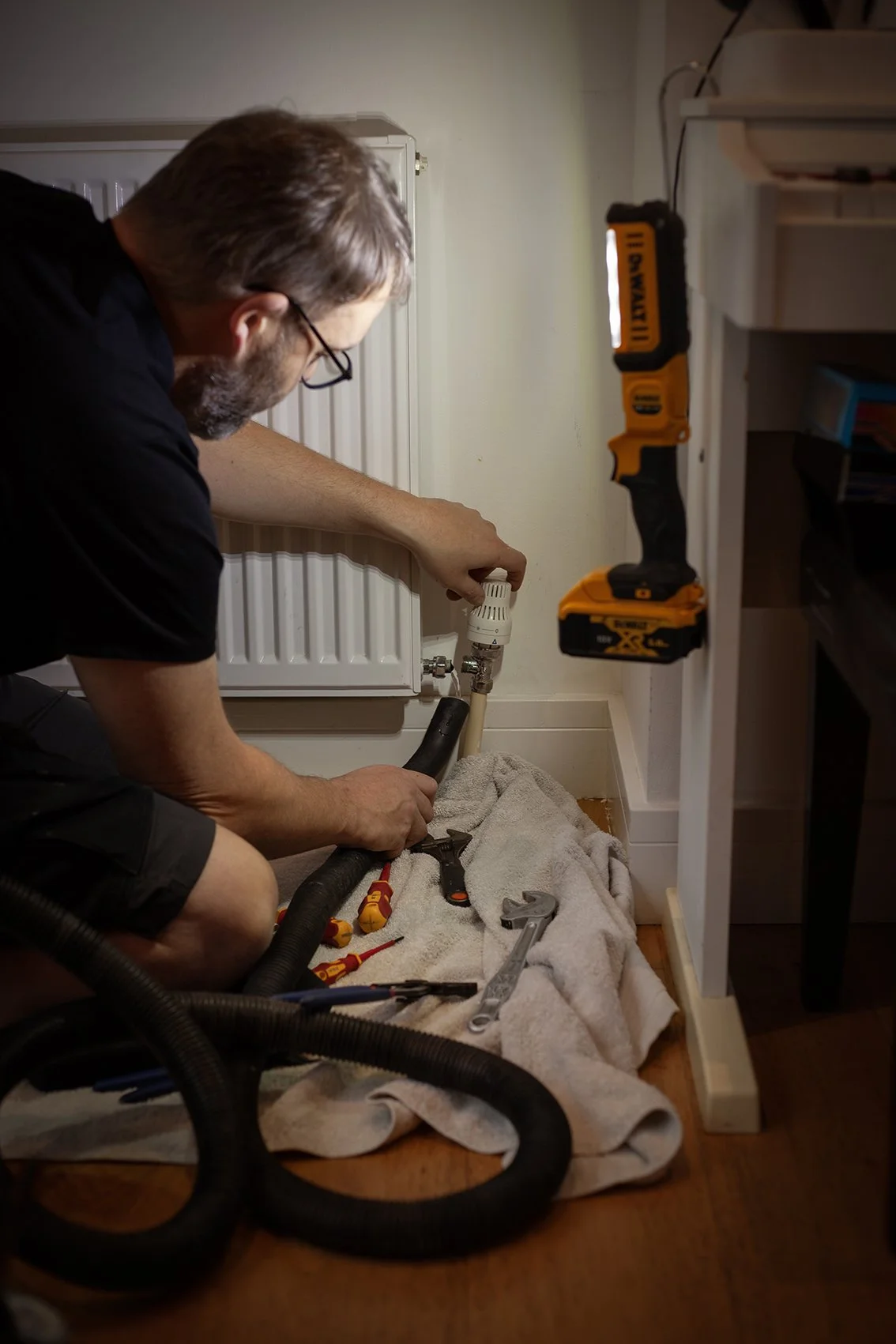 Aaron from AW Plumbing and Heating. At work on a radiator. Checkatrade work. Canterbury, UK. 2025