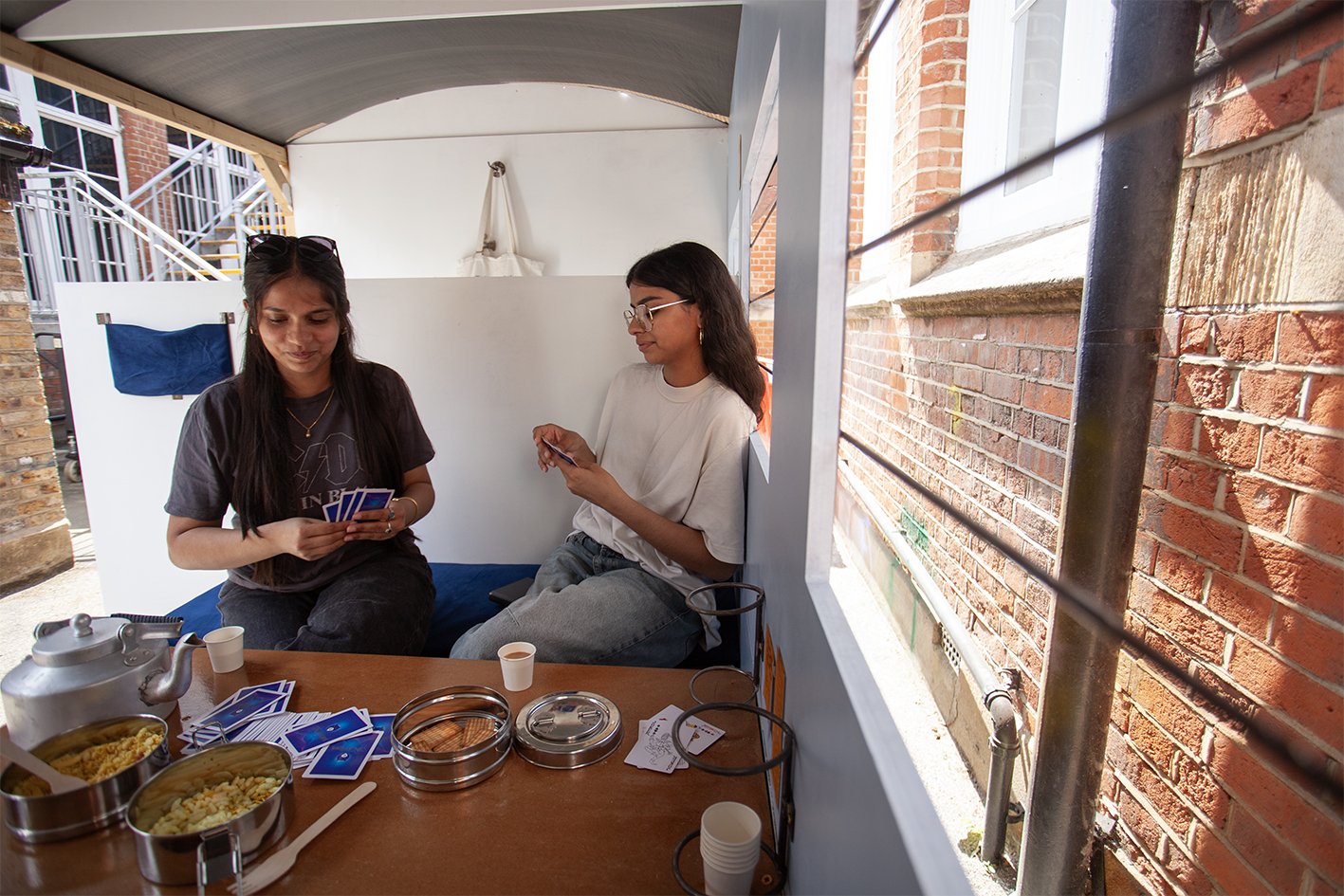 2025. Documenting an interactive sculpture piece made by Manav, an Indian artist. Manav constructed an immersive sculpture of a train that viewers can enter, listen to audio inside and eat Indian food.