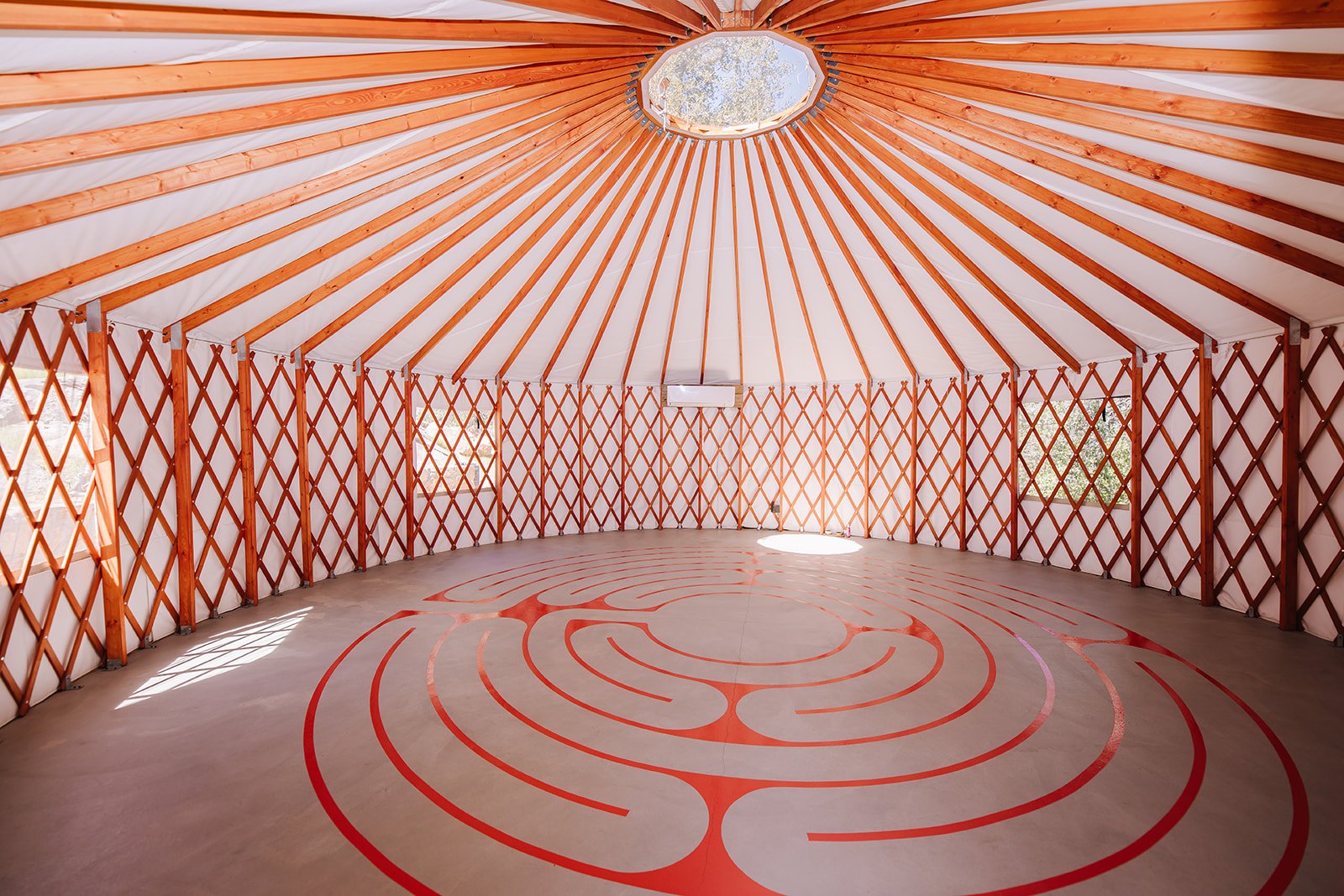 Spacious Yurt Interior with 4 Windows, Skylight, Labyrinth, and Heat/Air Conditioning Unit