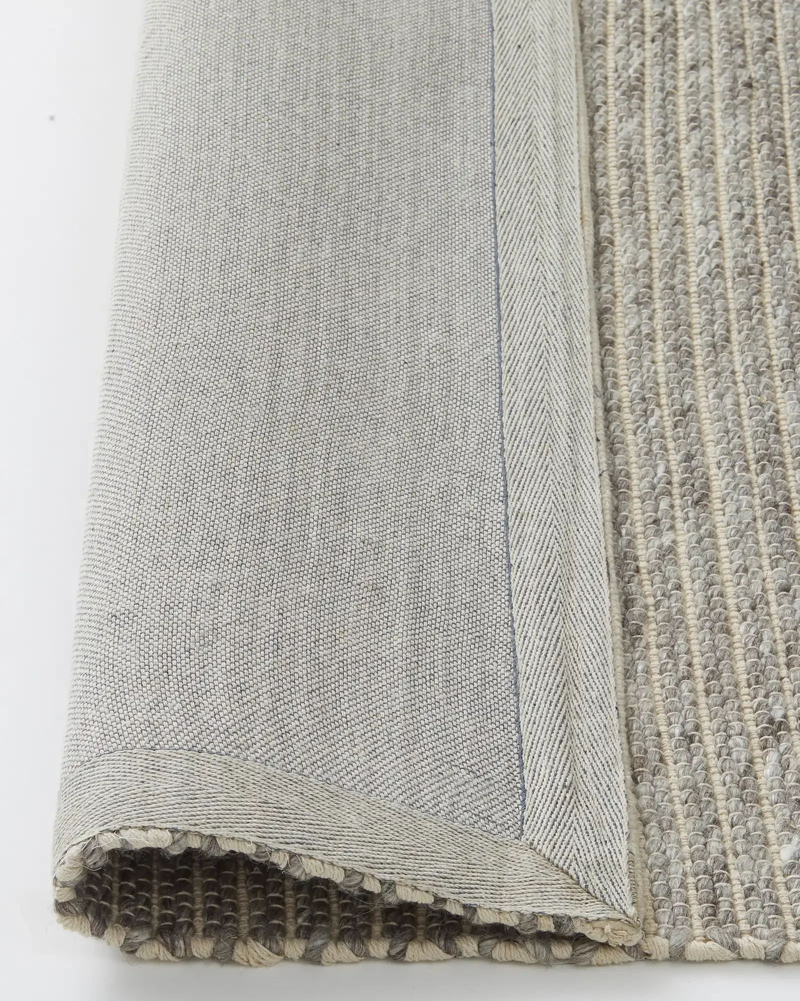 recLYP6vL5IWy7Gnm_Andes_Feather_Rug_Backing.webp