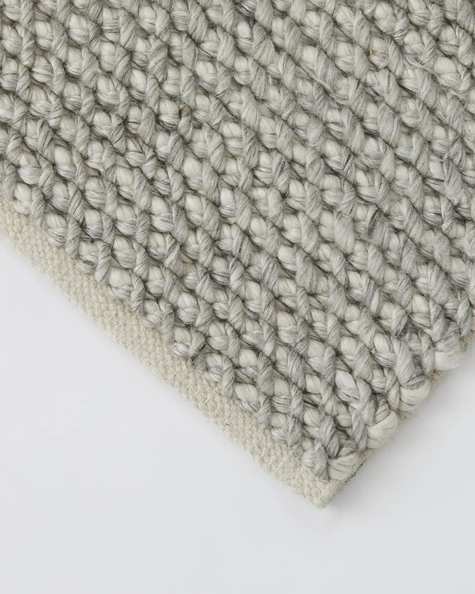 reclMvj2kziTnFqZr_Emerson_Rug_Feather_Details.webp