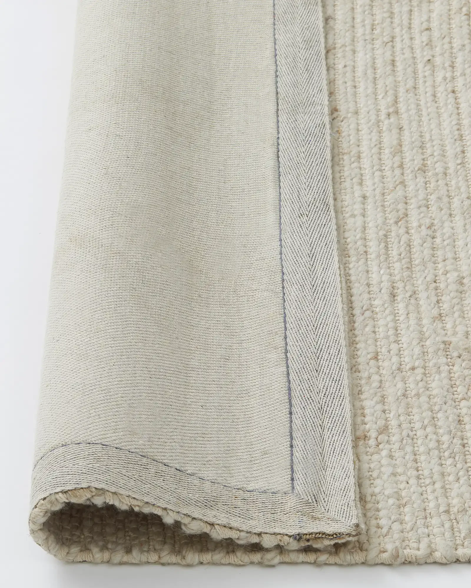 rec0Zmi10yJbMarNP_Andes_Sandstorm_Rug_Backing.webp