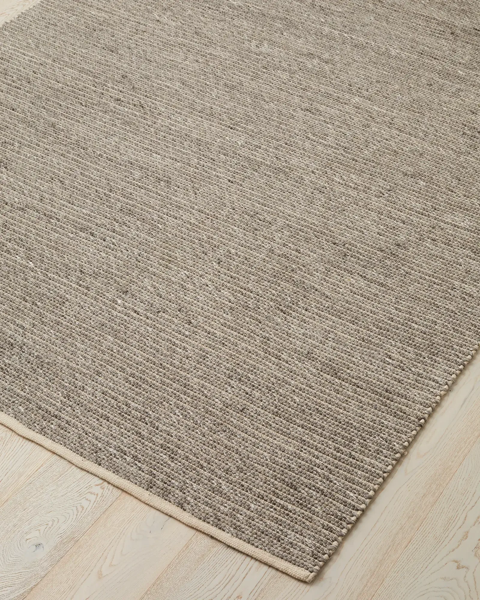 rec8KBVTdNHHLM3Fn_Andes_Feather_Rug_Corner.webp