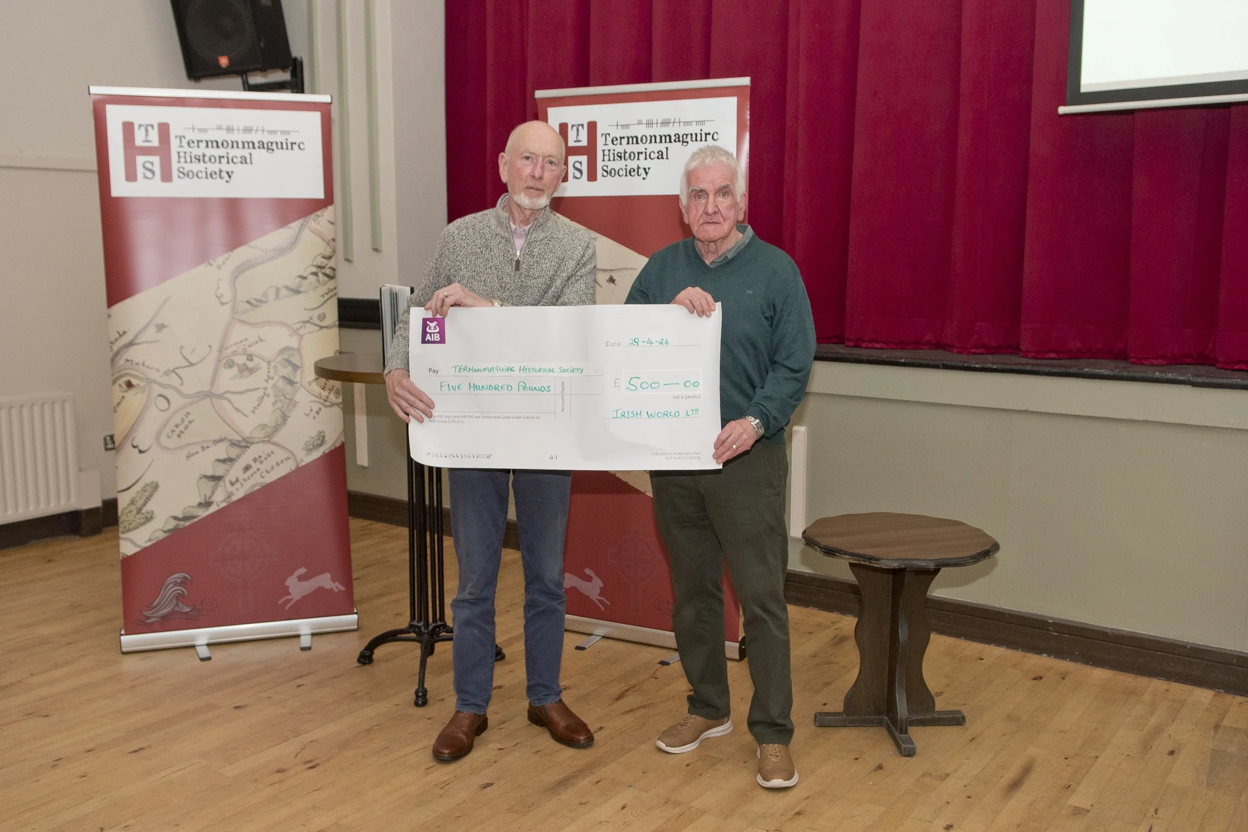 Willie O'Kane presents a cheque to Cormac Mc Aleer