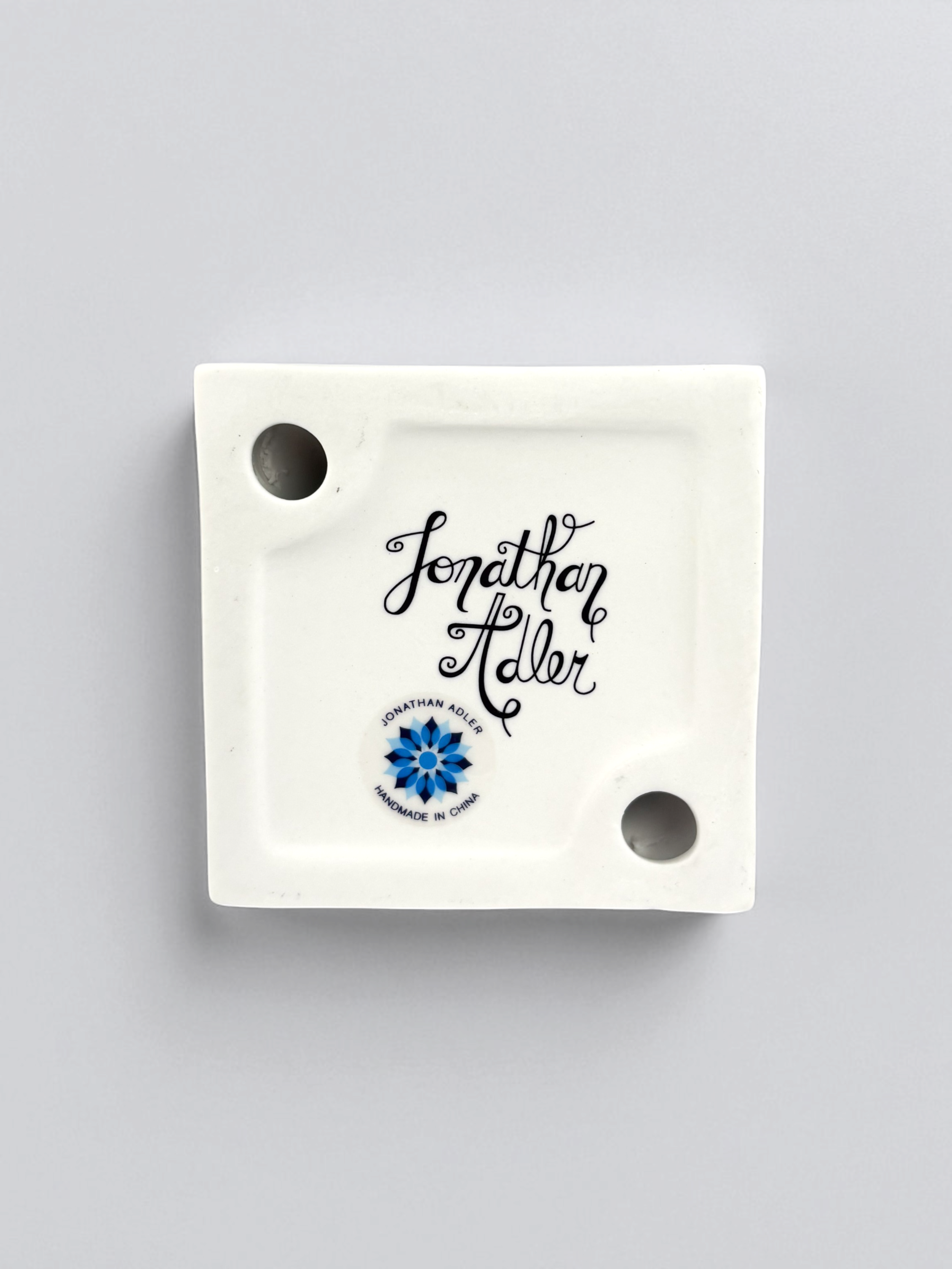Jonathan Adler I-Scream Match Strike, pre-owned. A white porcelain figurine shaped like a hand holding an ice cream cone.