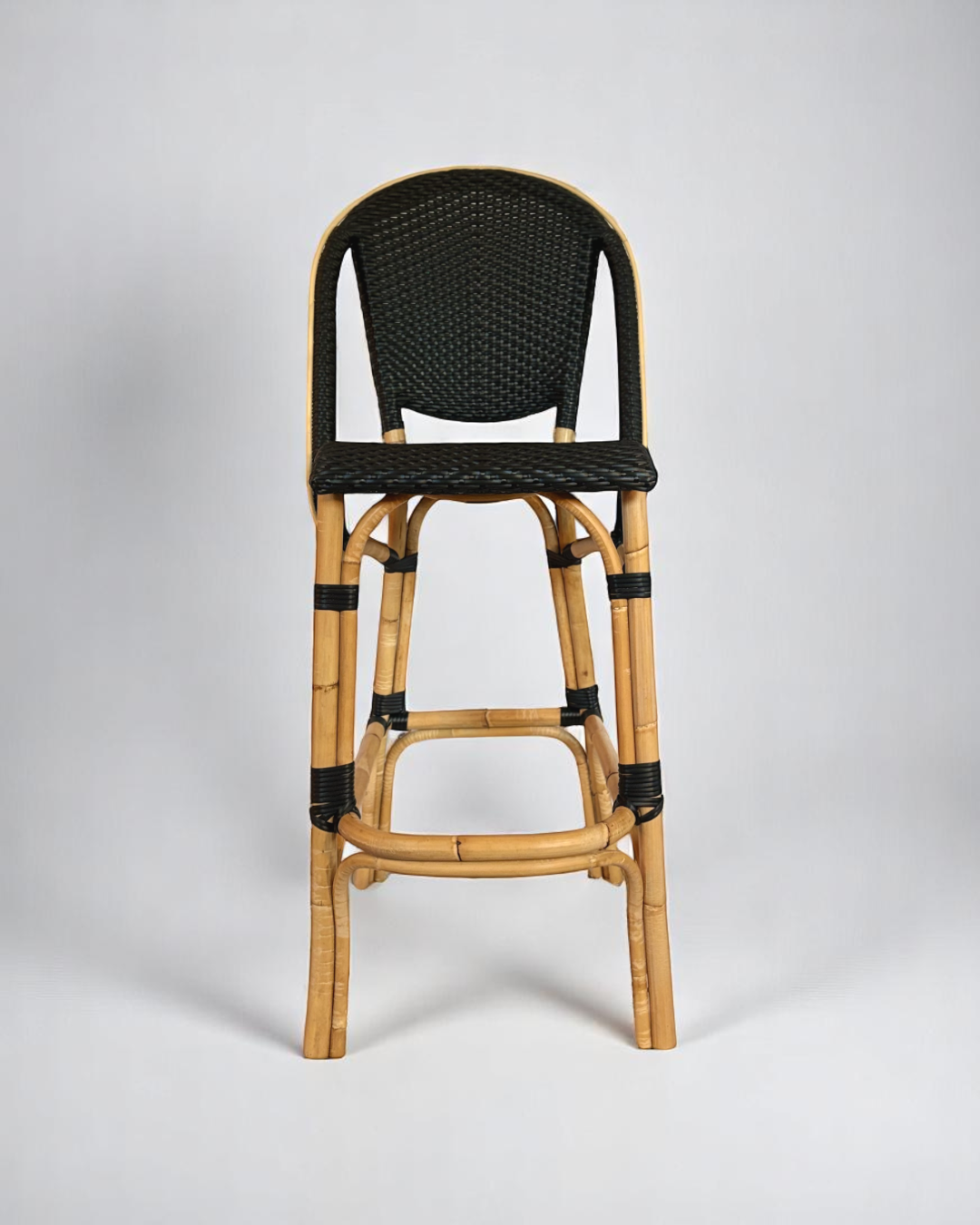 Pre-owned, Sofie Bar Stool by Sika Design, featuring a natural rattan frame with black woven seat and back.