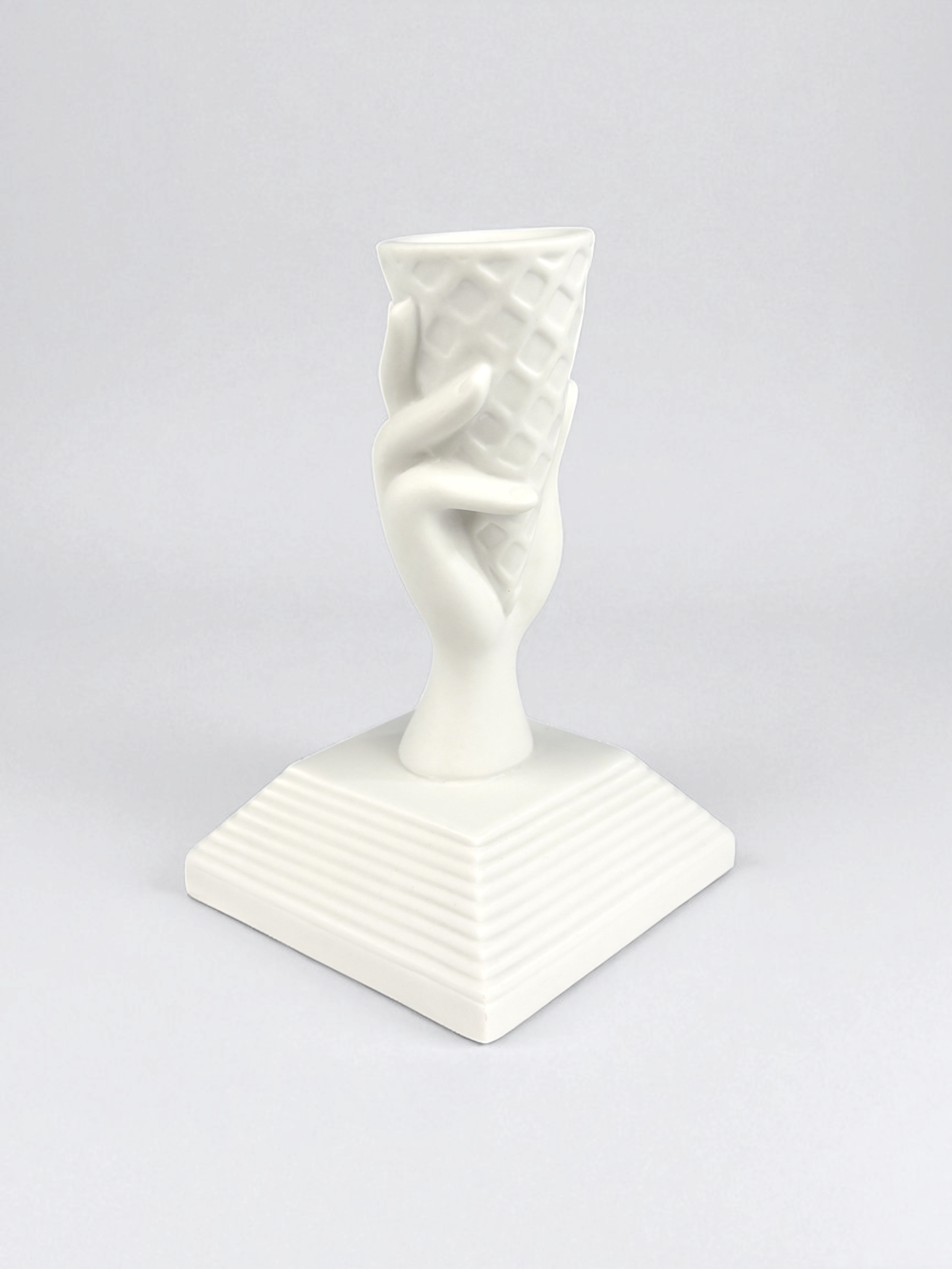Jonathan Adler I-Scream Match Strike, pre-owned. A white porcelain figurine shaped like a hand holding an ice cream cone.