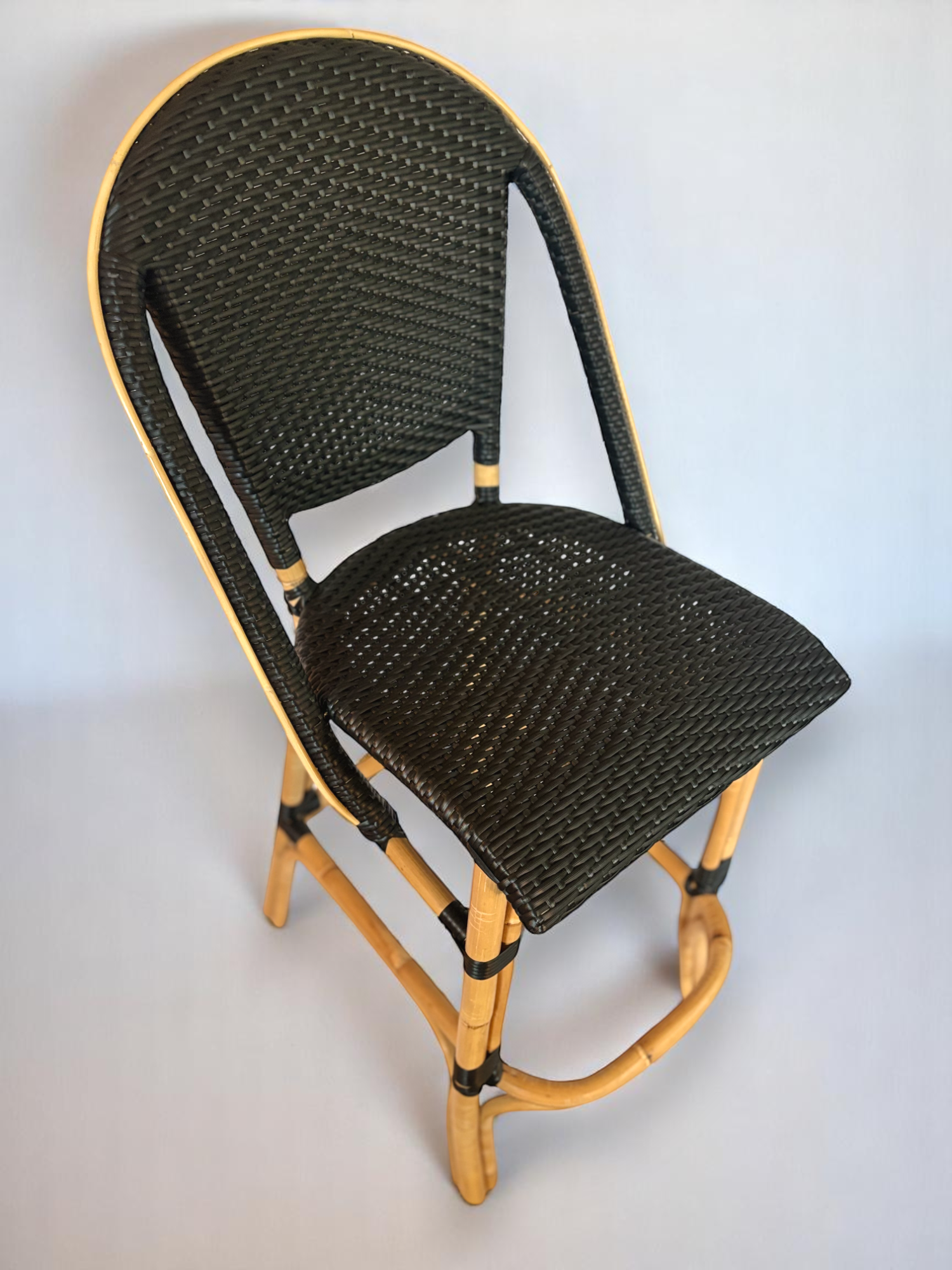 Pre-owned, Sofie Bar Stool by Sika Design, featuring a natural rattan frame with black woven seat and back.