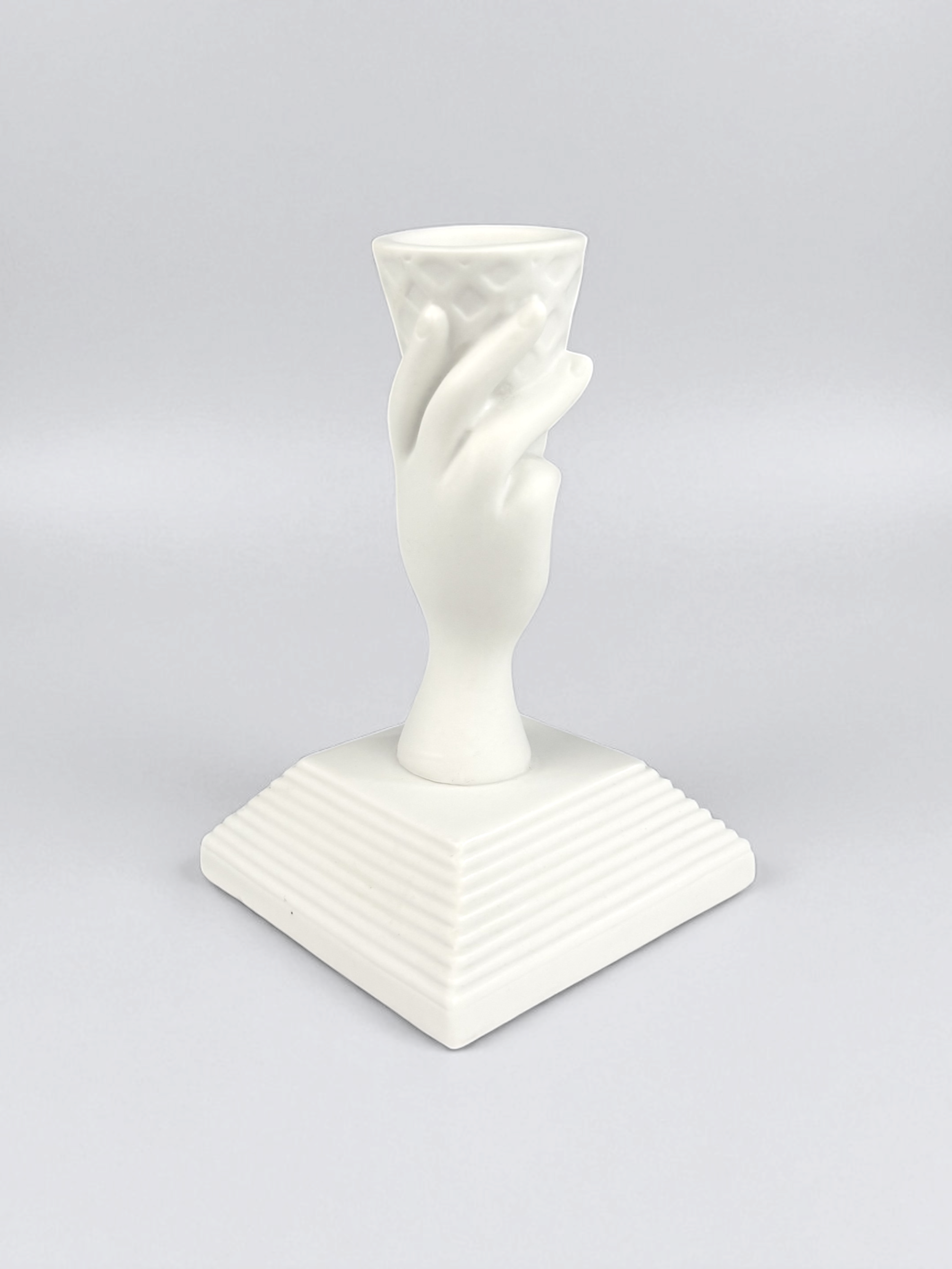 Jonathan Adler I-Scream Match Strike, pre-owned. A white porcelain figurine shaped like a hand holding an ice cream cone.
