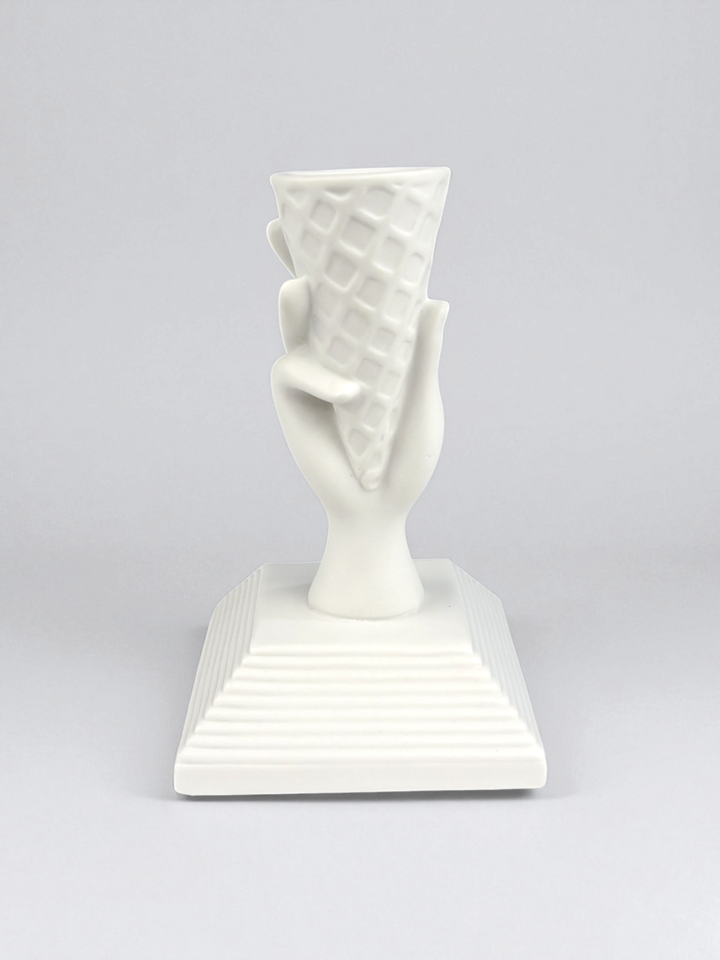 Jonathan Adler I-Scream Match Strike, pre-owned. A white porcelain figurine shaped like a hand holding an ice cream cone.