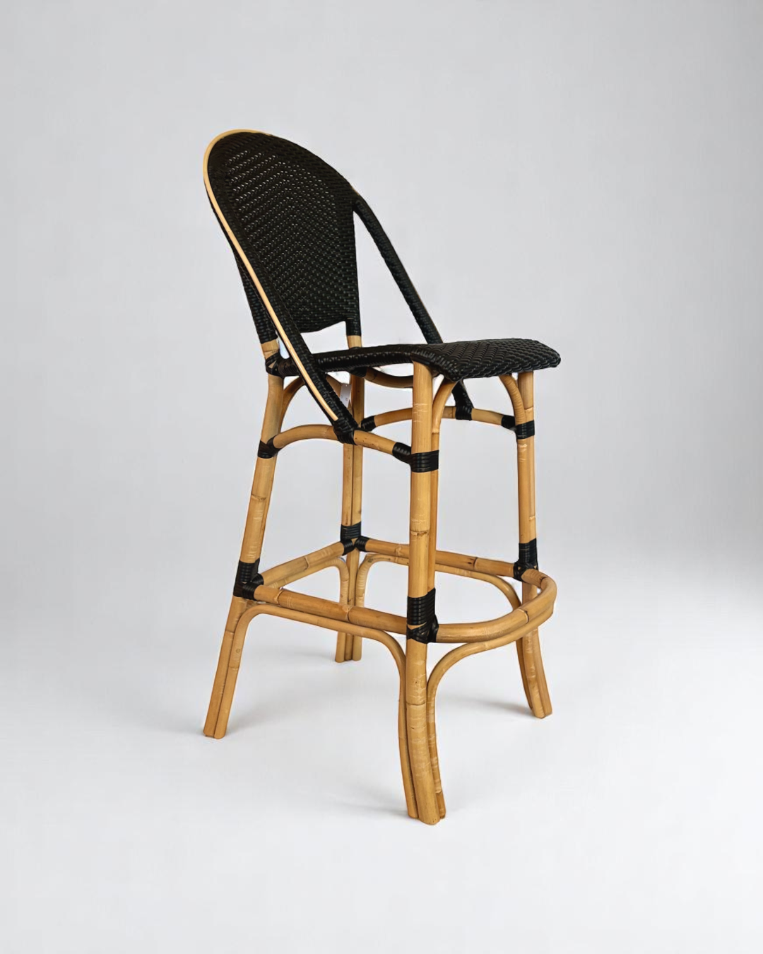 Pre-owned, Sofie Bar Stool by Sika Design, featuring a natural rattan frame with black woven seat and back.