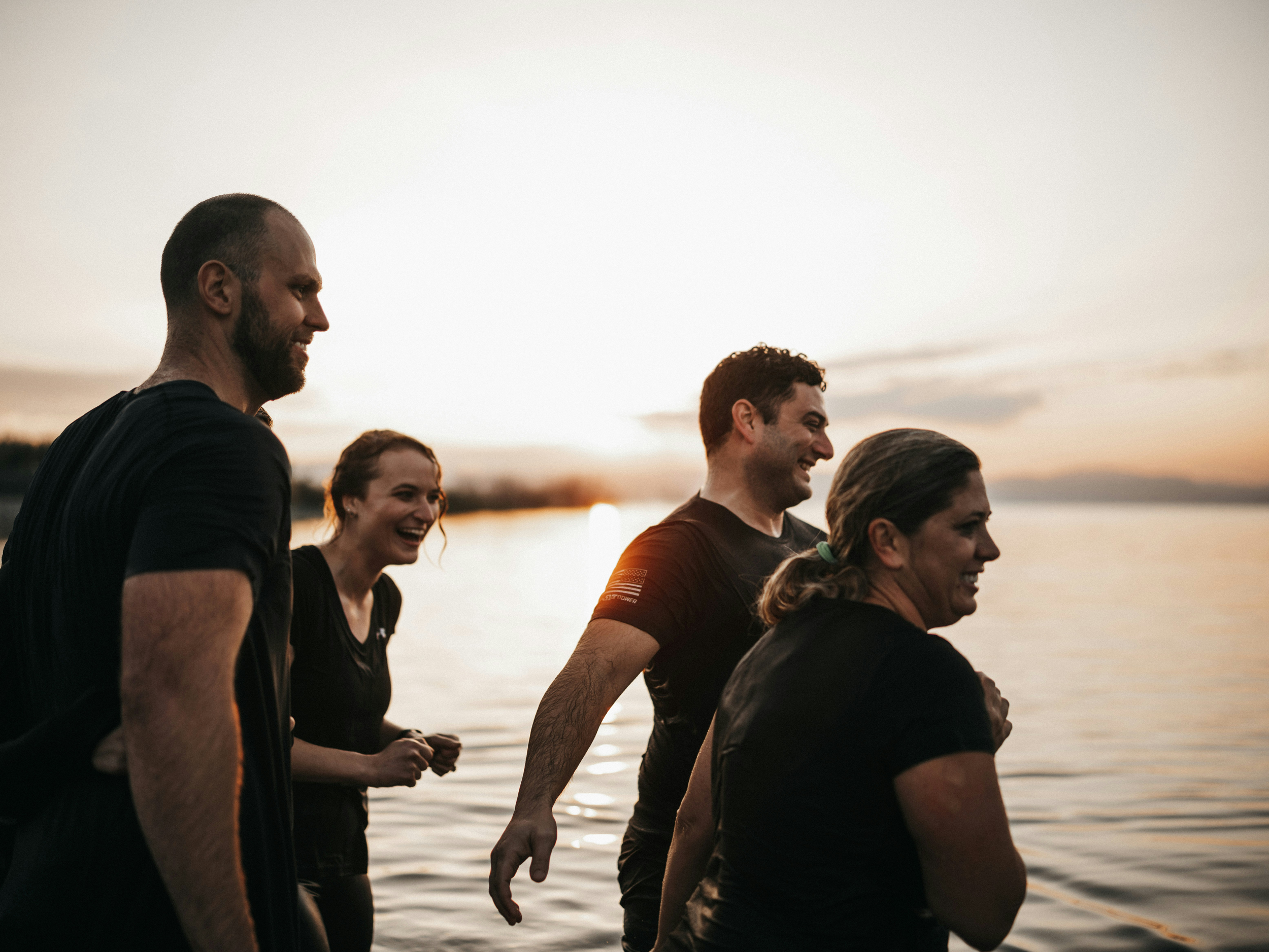 Four colleagues smiling at a company offsite