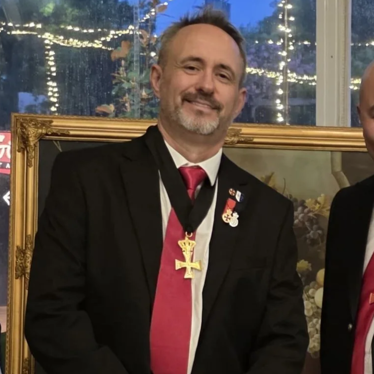 Coat of arms of Lithuania featuring a shield with a red cross, surrounded by angels, flags, and a crown, with a banner reading 'non nobis domim'e.