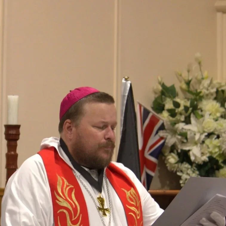 Coat of arms of Lithuania featuring a shield with a red cross, surrounded by angels, flags, and a crown, with a banner reading 'non nobis domim'e.