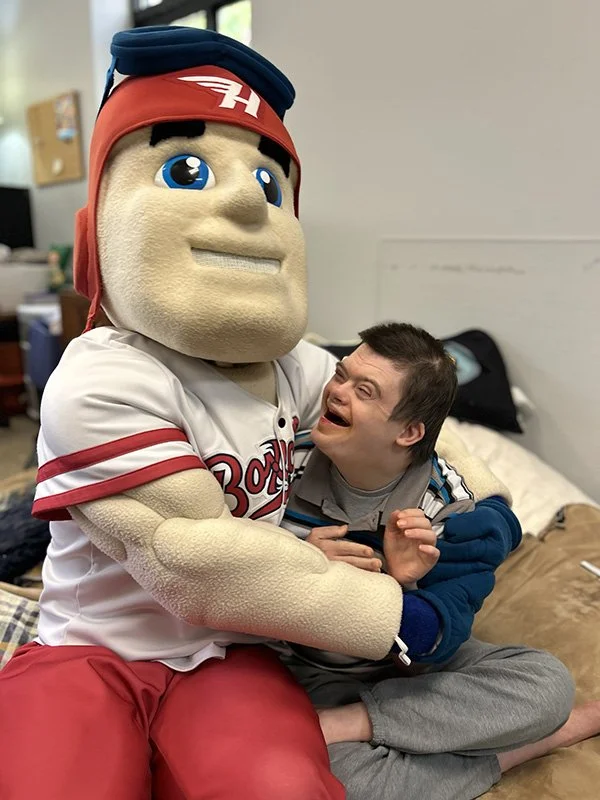 Man Smiling with Flying Boxcar Mascot.jpg