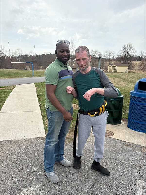 Man Supported with Staff Member.jpg