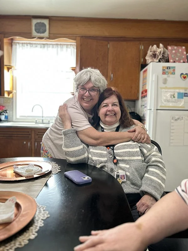 two friends smiling
