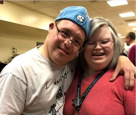 Two smiling faces at The Arc of Washington County day program