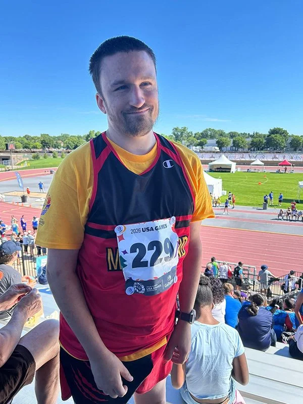 man smiling at competition