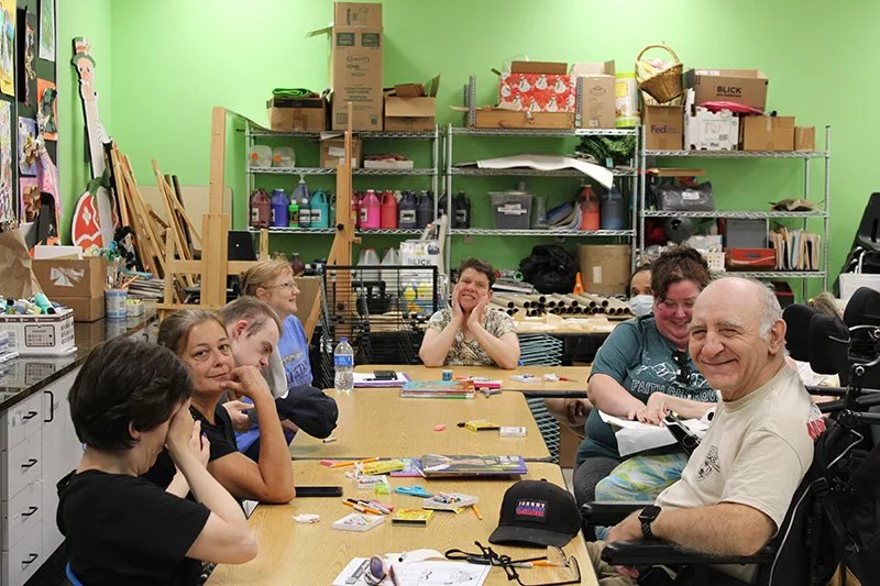 group of people making artwork