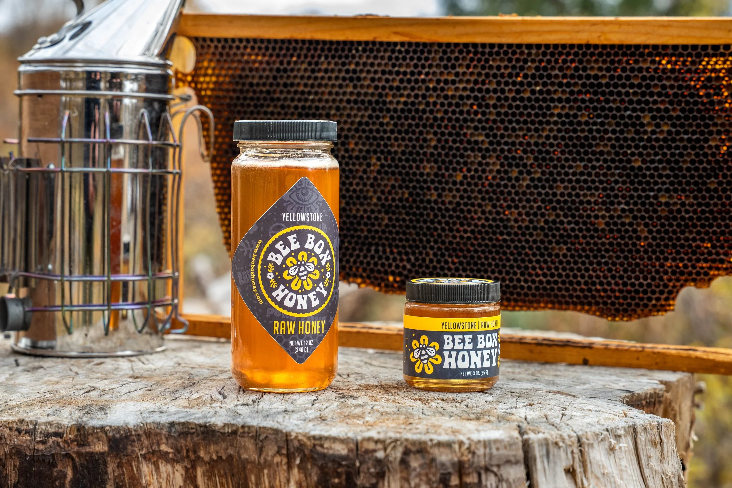 Branding photography featuring premium honey products showcased in a natural outdoor environment.