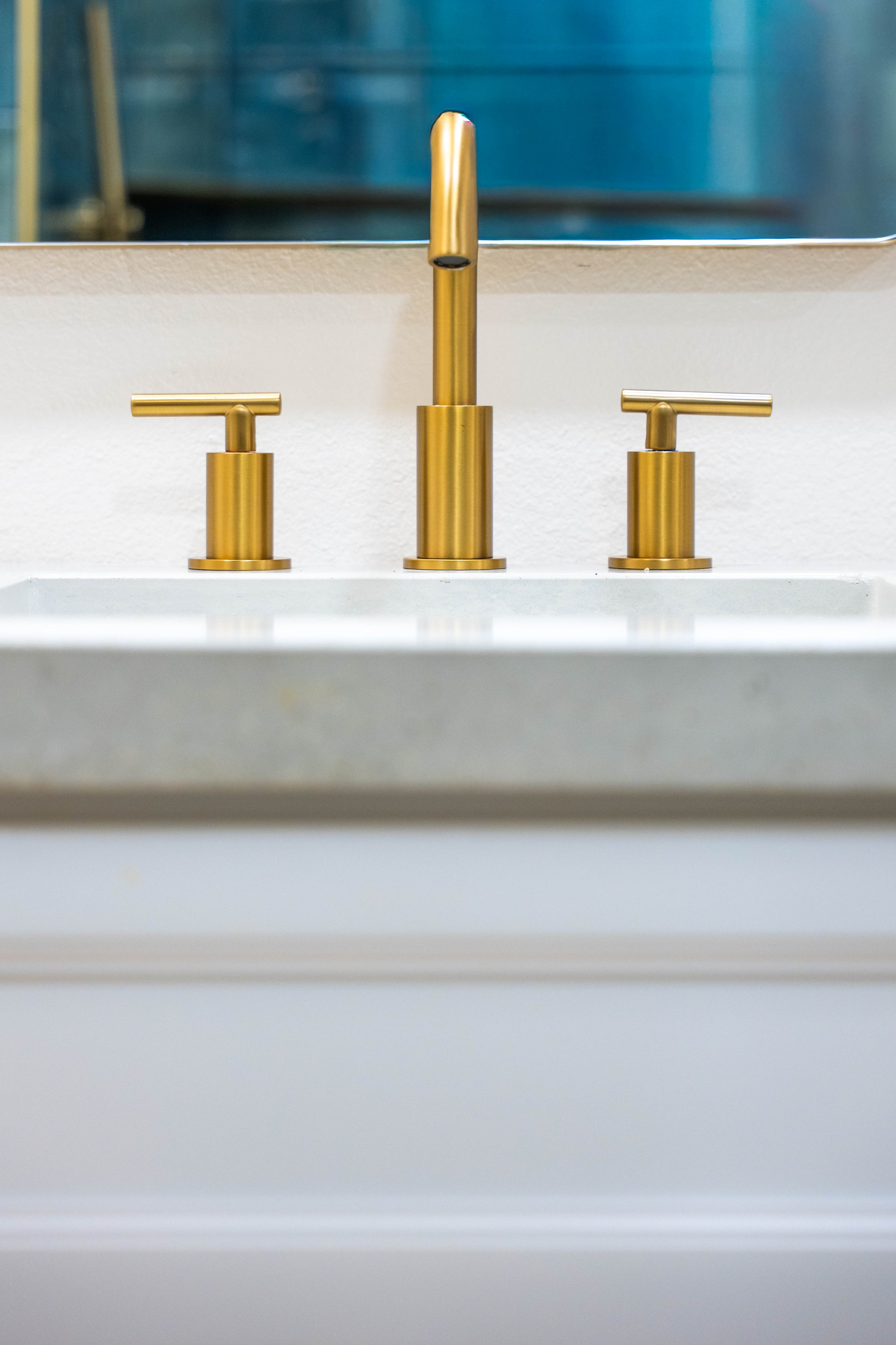 Final renovation photo highlighting updated vanity, mirrors, and lighting in a Phoenix bathroom.
