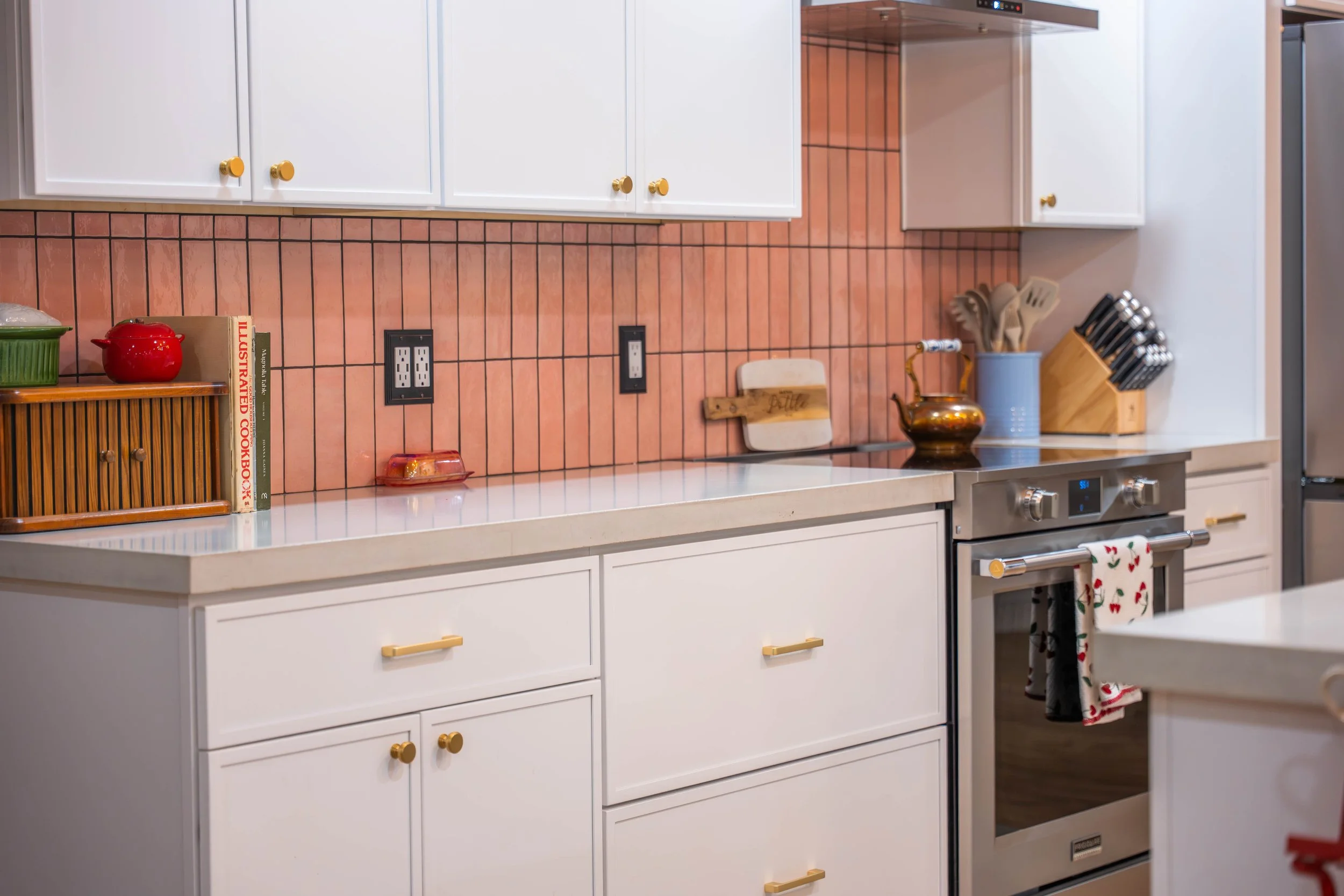 Professional kitchen reveal image featuring modern lighting, hardware, and finishes in a Phoenix remodel.