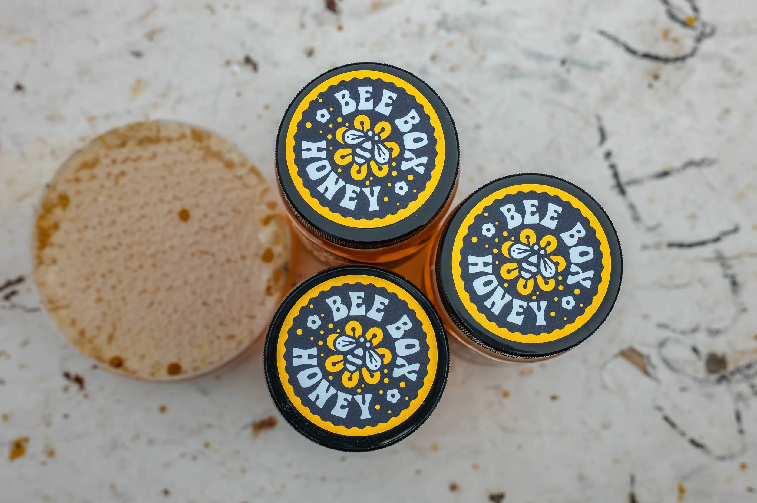 Outdoor product photography of honey jars created for brand marketing and visual storytelling