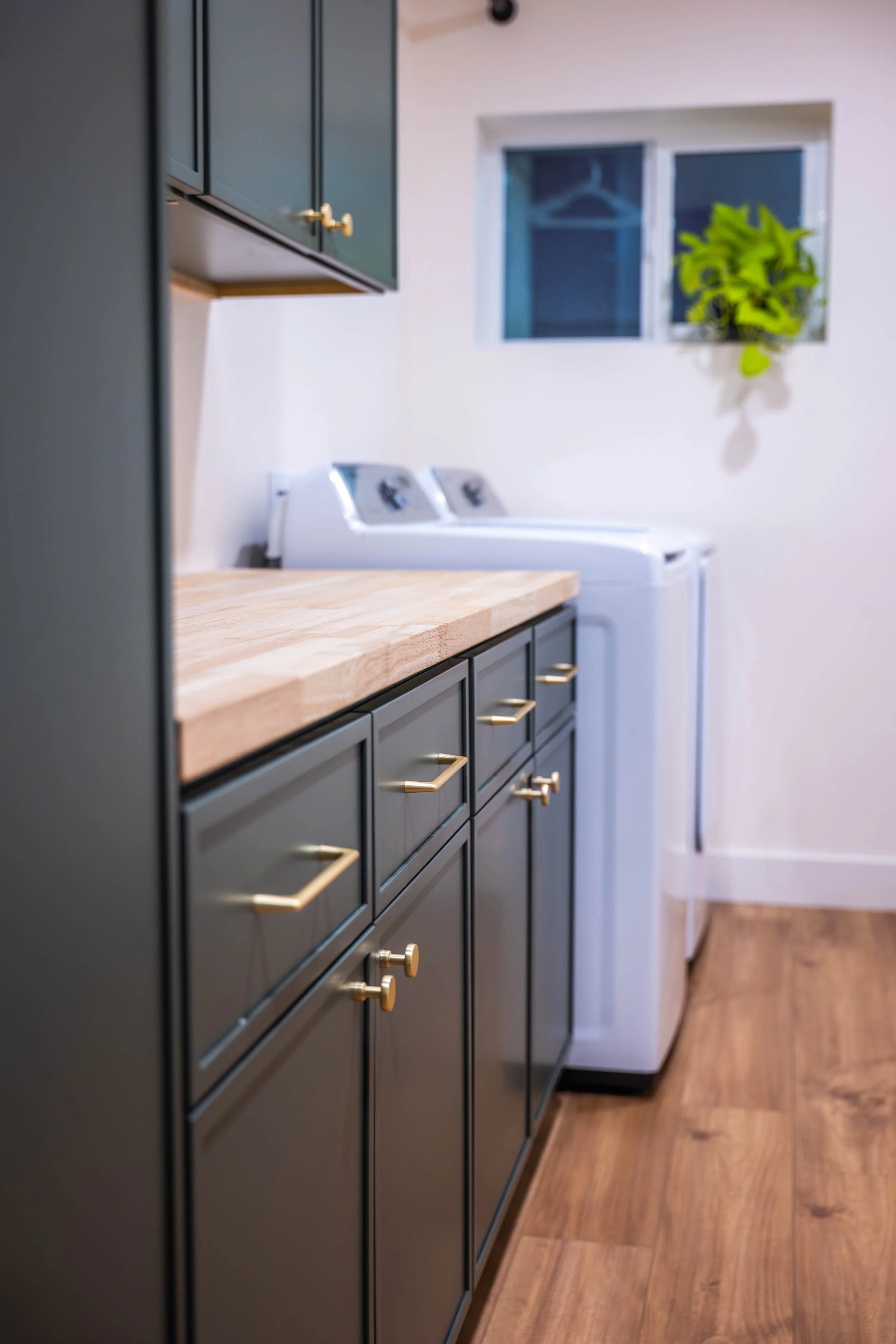 Professional interior shot documenting the finished laundry room remodel in Phoenix.