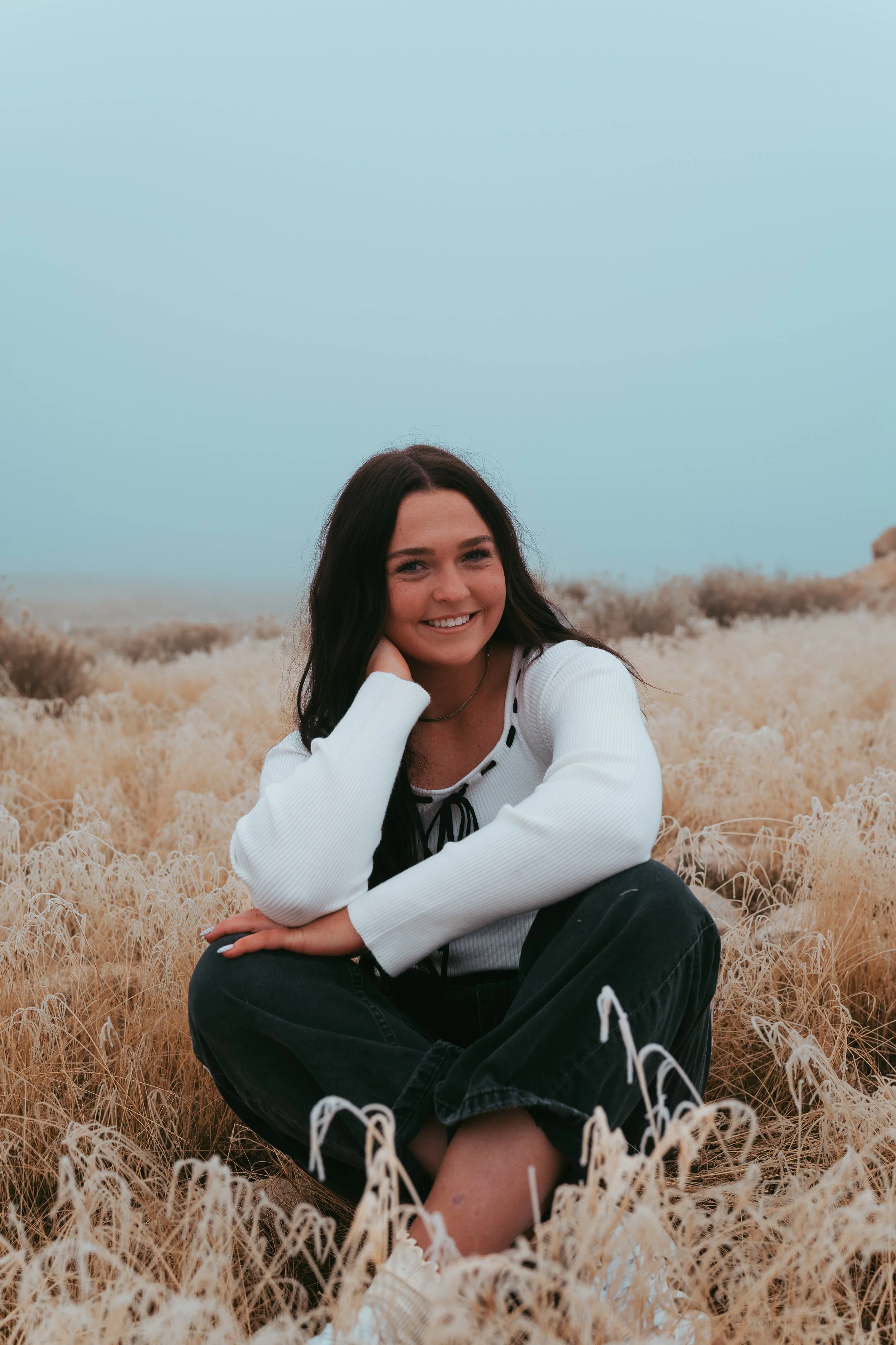 Portrait of young woman framed by soft shadows and neutral palette