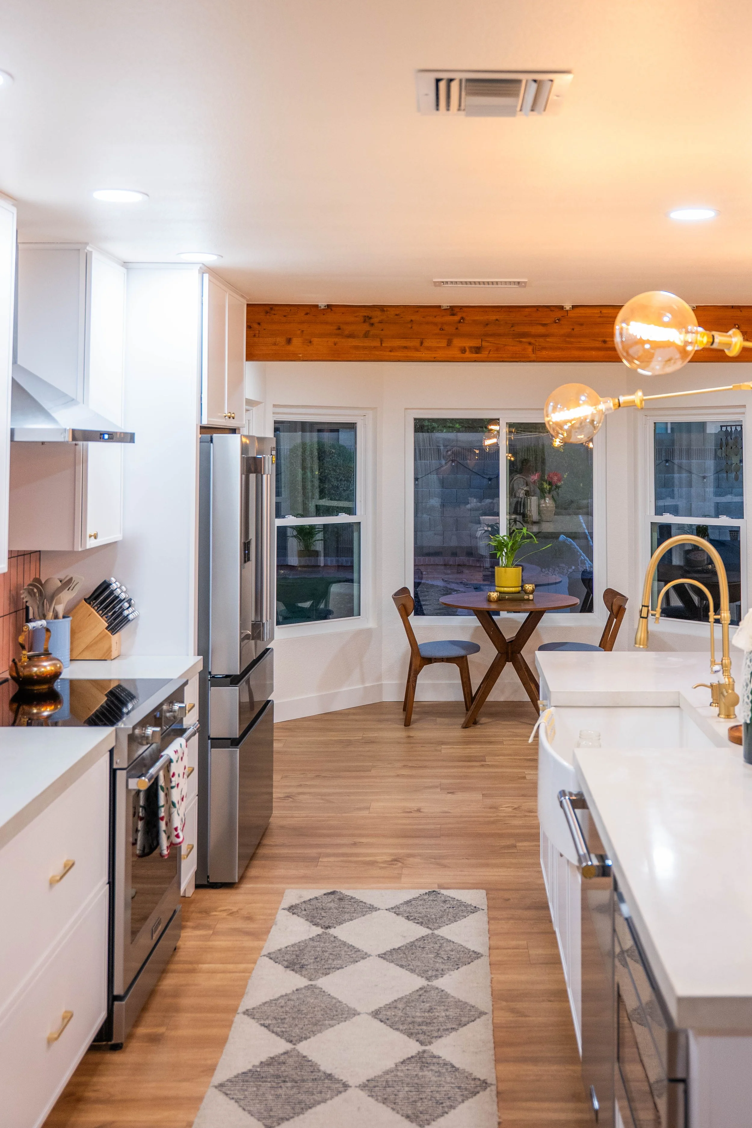 Commercial photography capturing the upgraded kitchen layout and materials for a Phoenix renovation project.