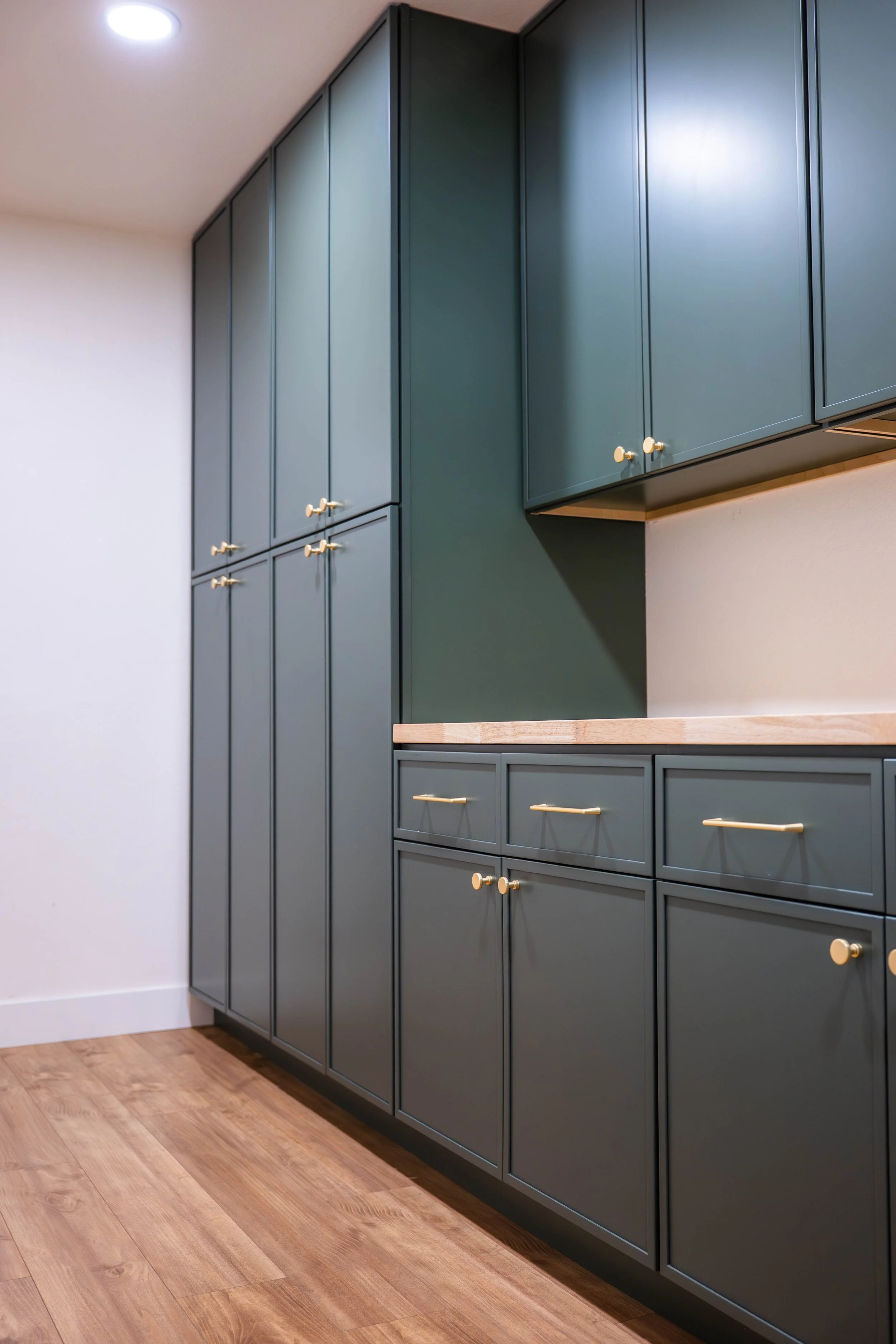 Laundry room reveal image highlighting new storage, shelving, and upgraded layout in Phoenix